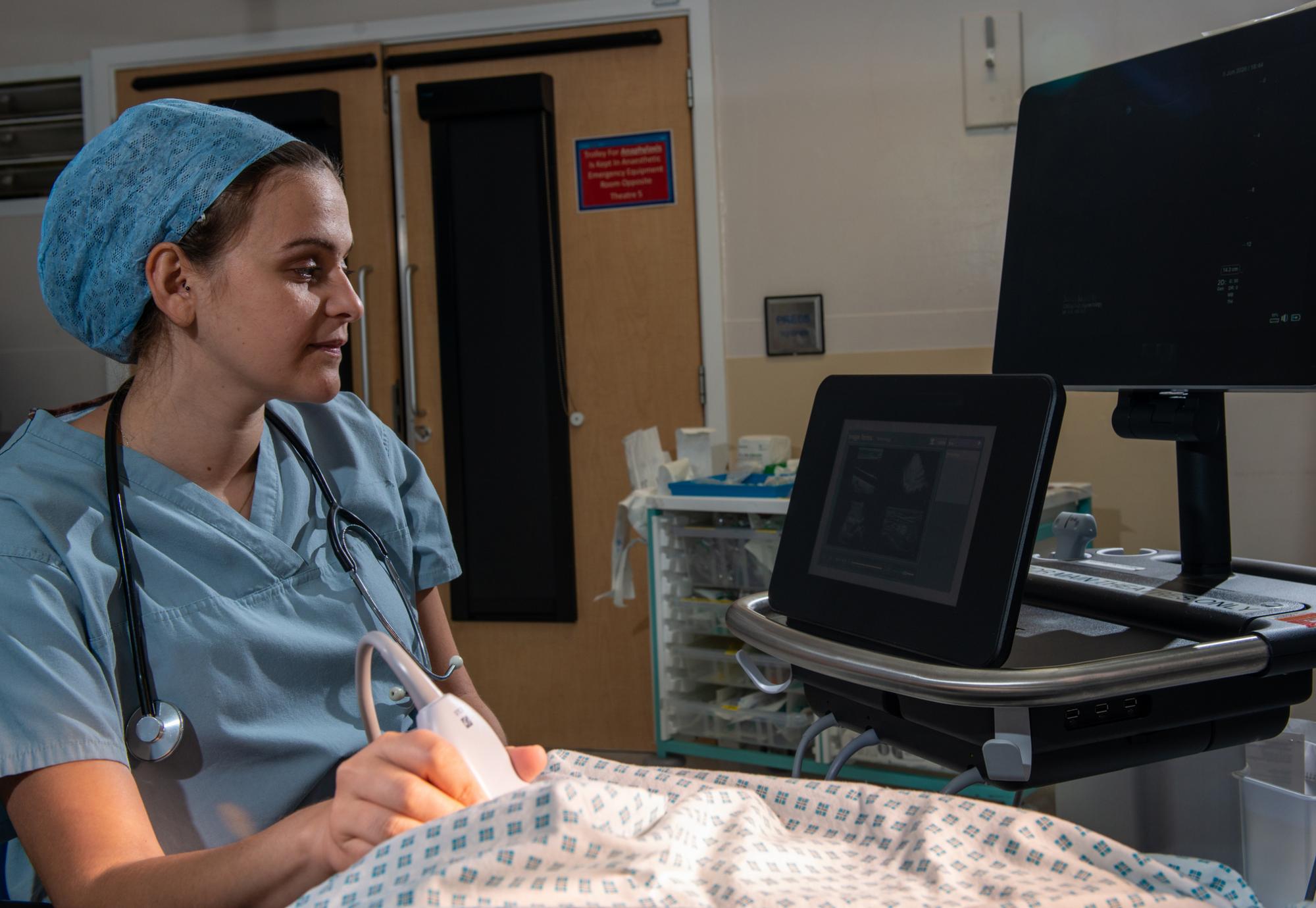 NHS worker scanning a patient