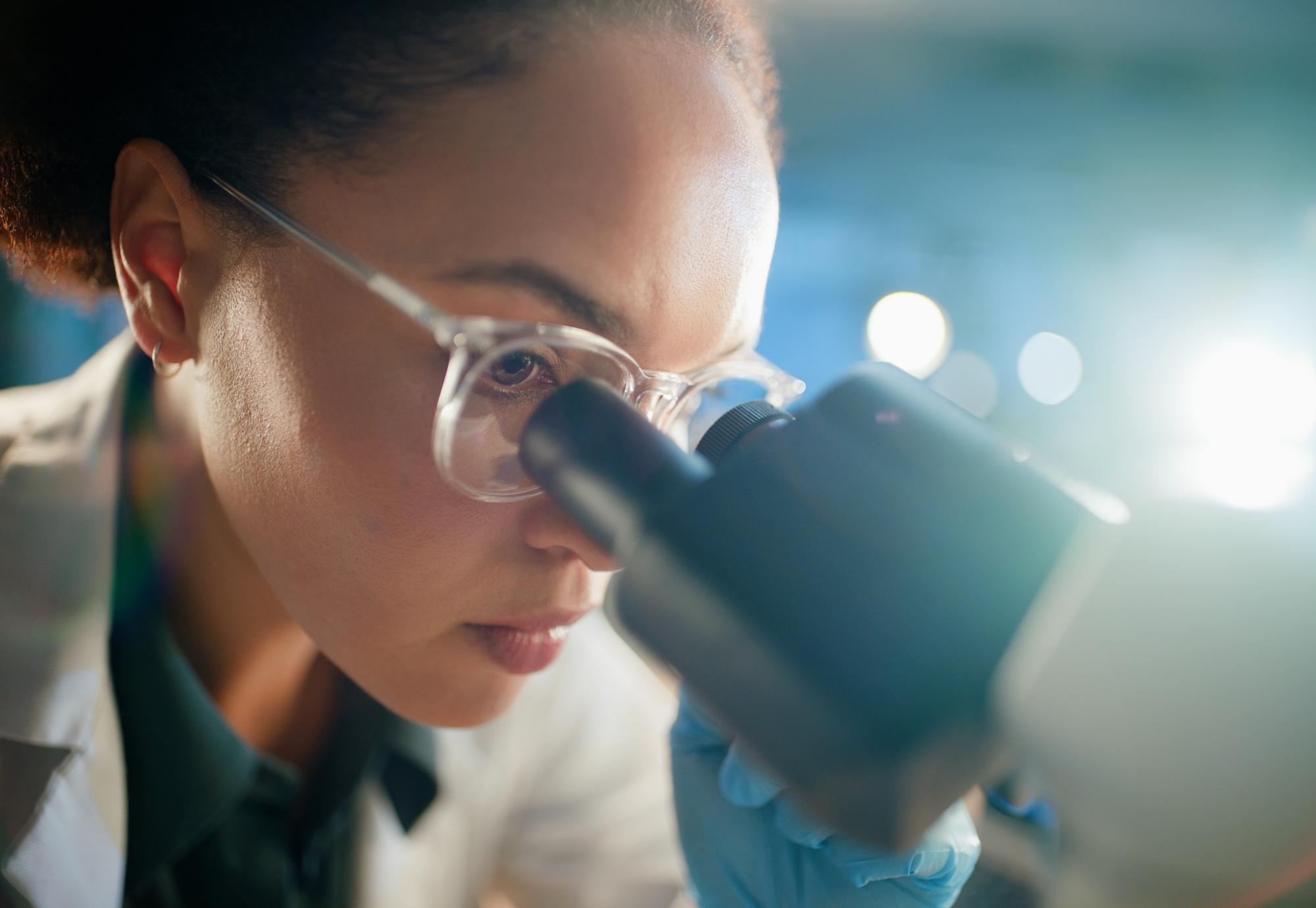 Women looking into a microscope