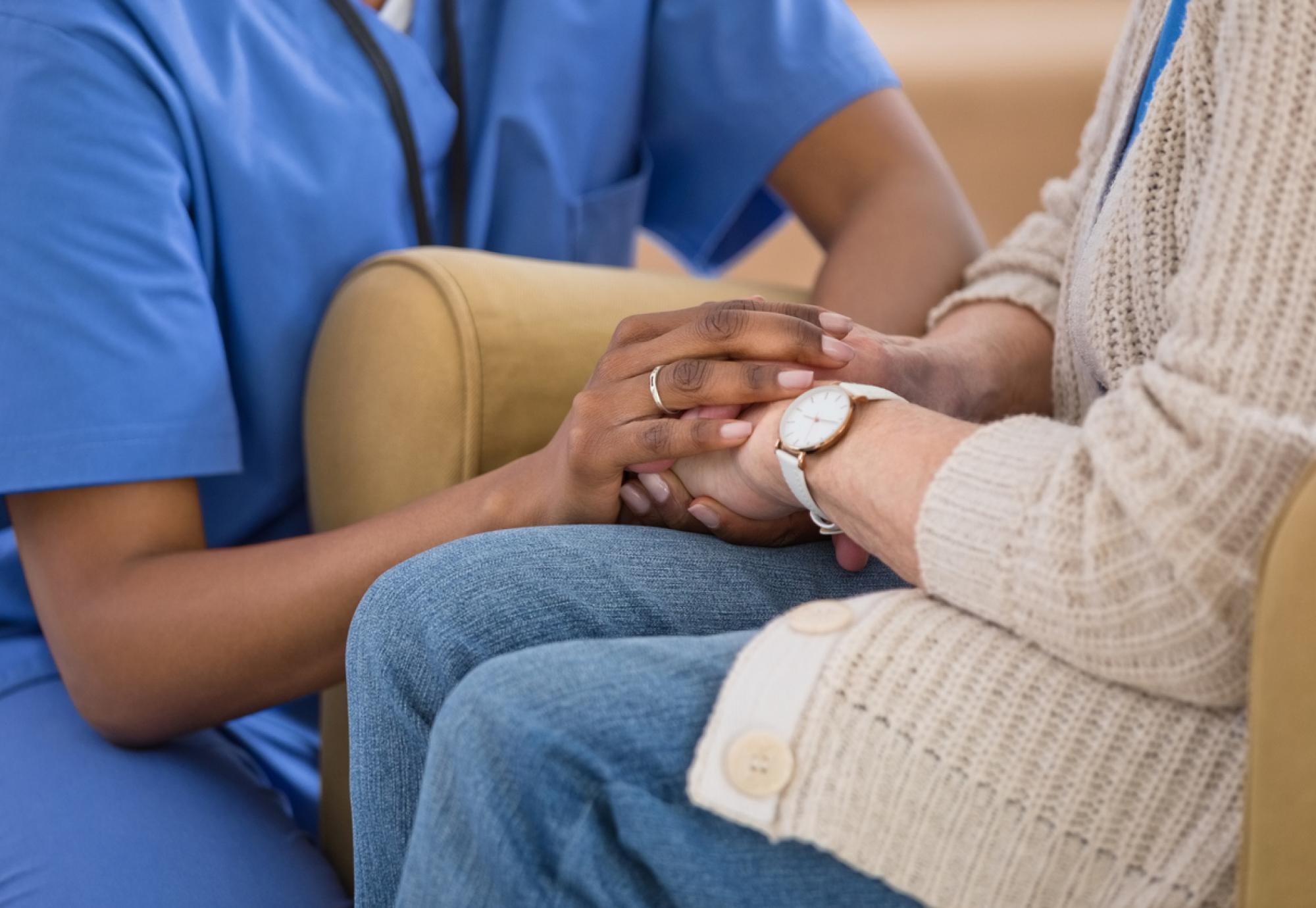 nurse taking care of woman with cancer