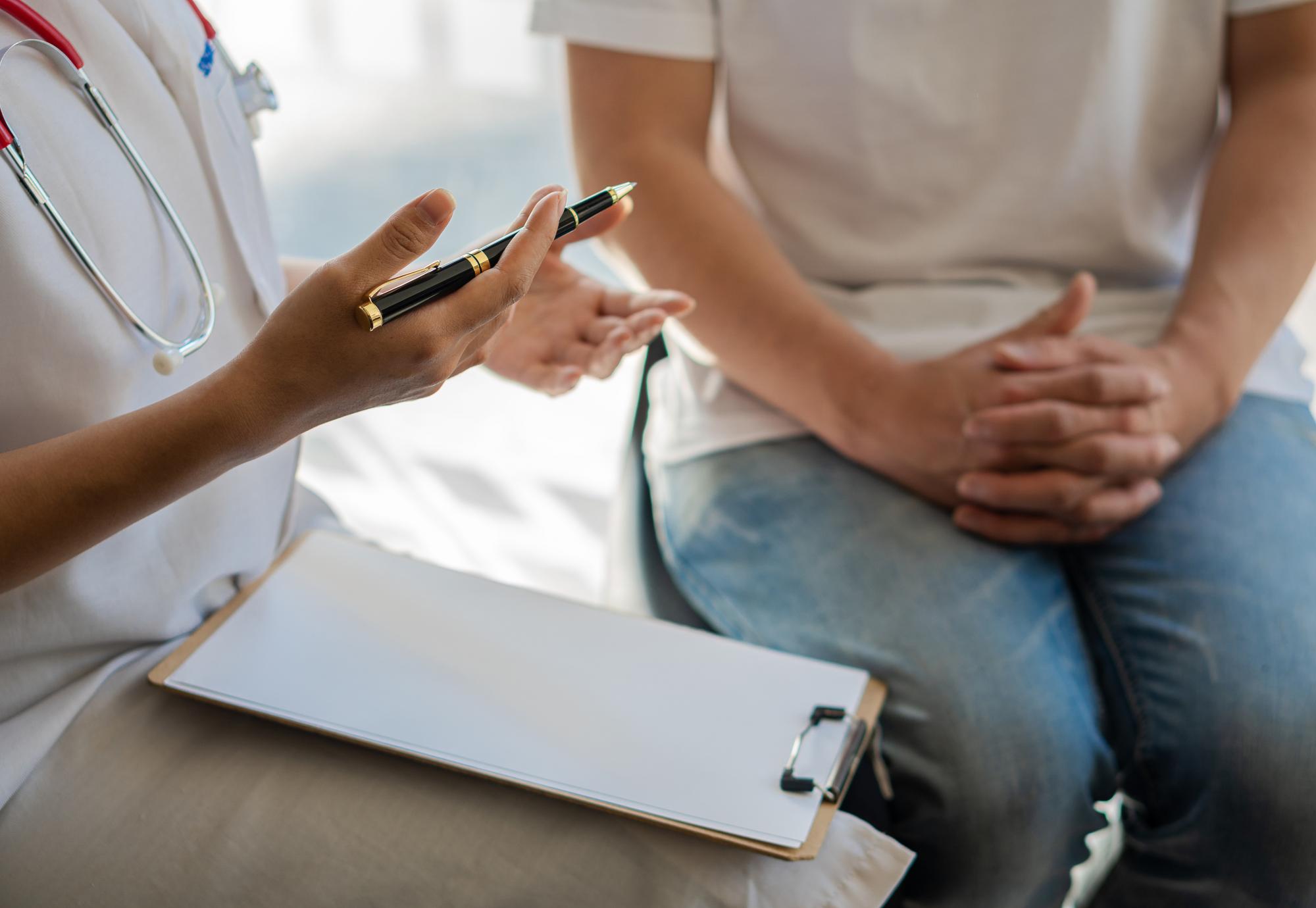 Doctor diagnoses a patient