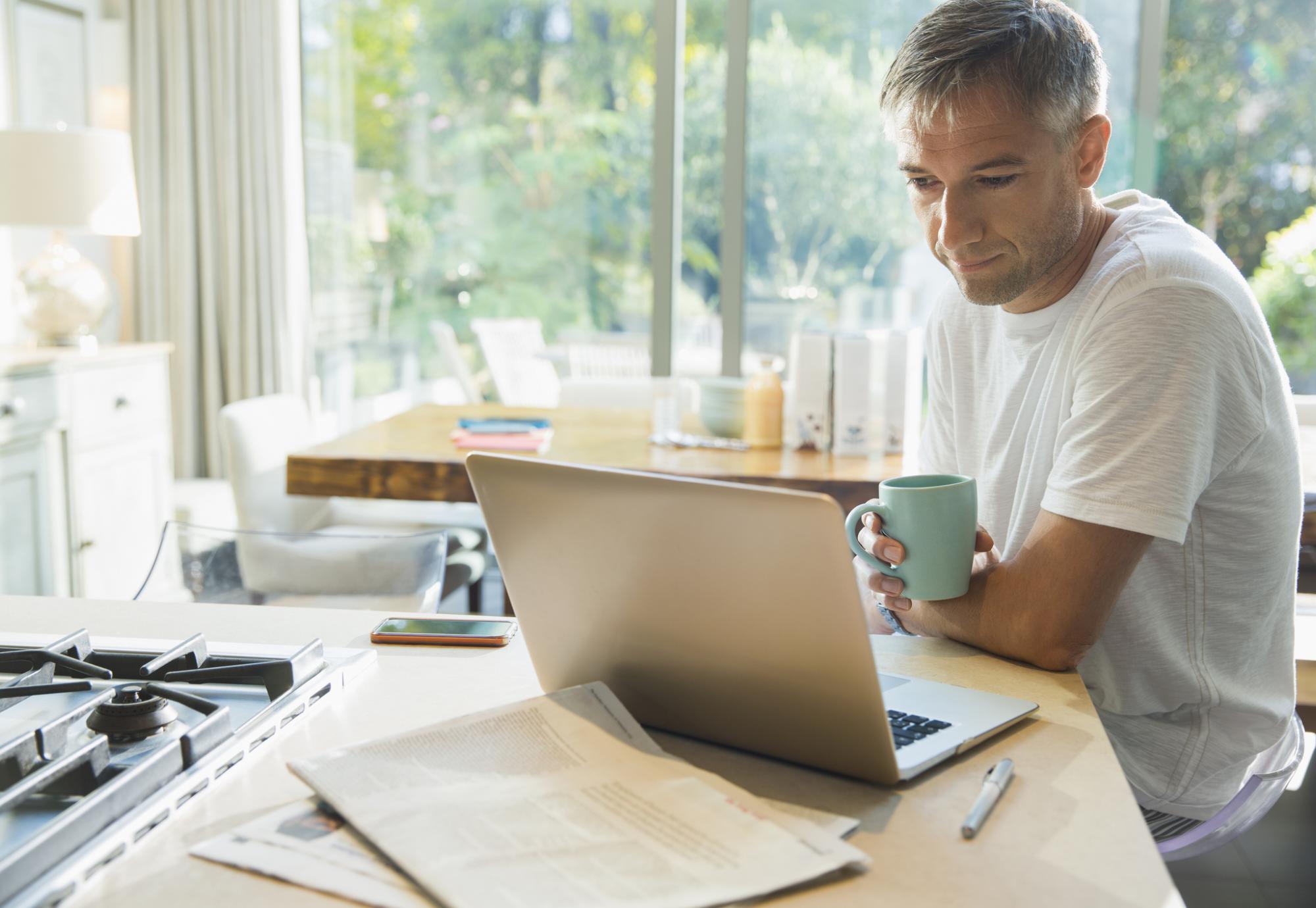 Man using a laptop at home