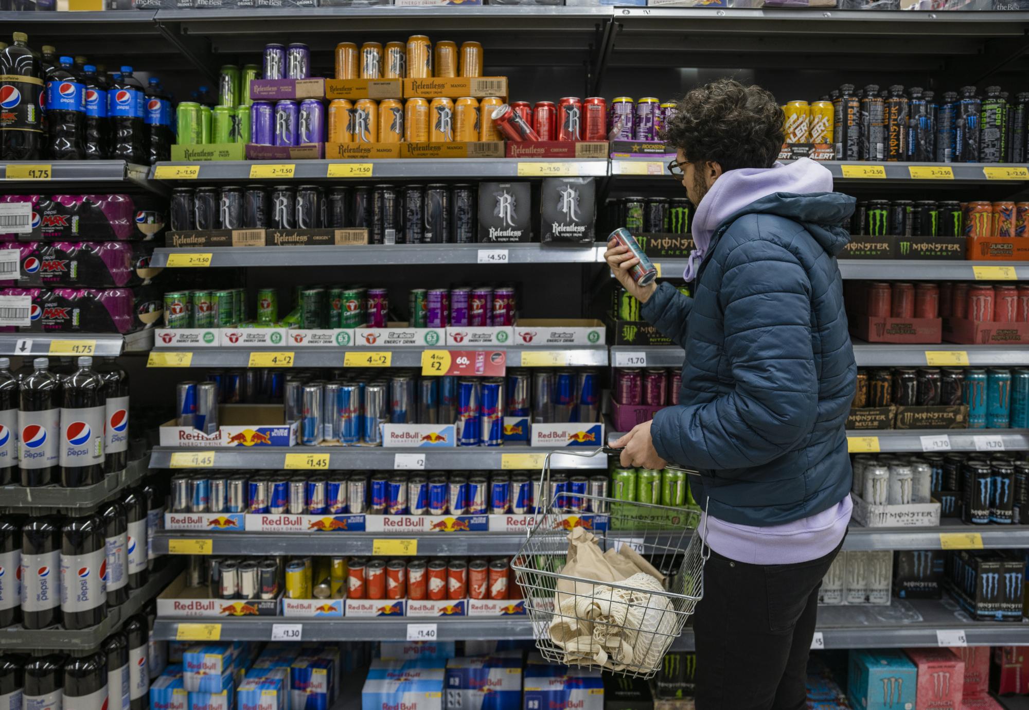 Person buying energy drink