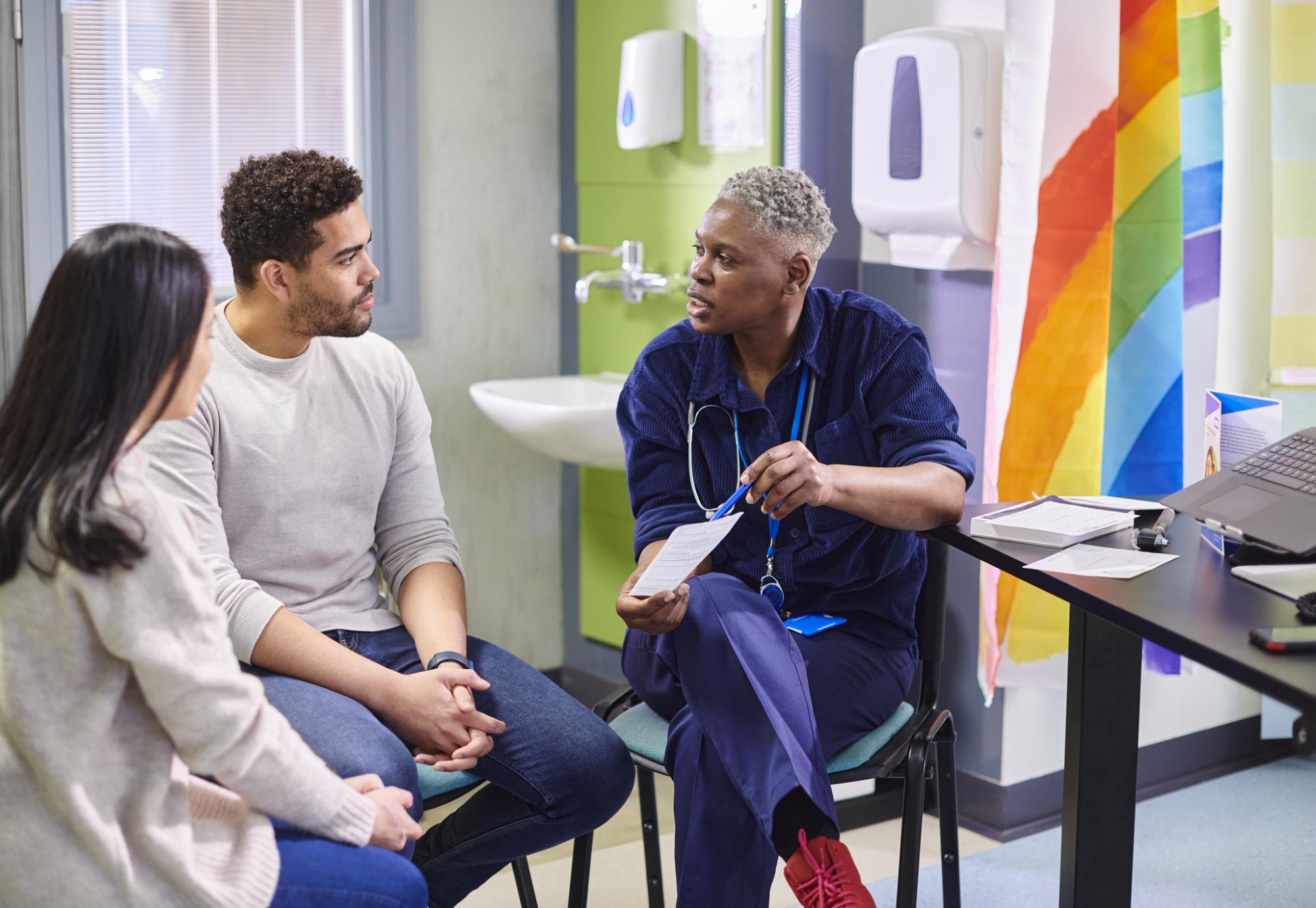 Doctor talking to a black male patient