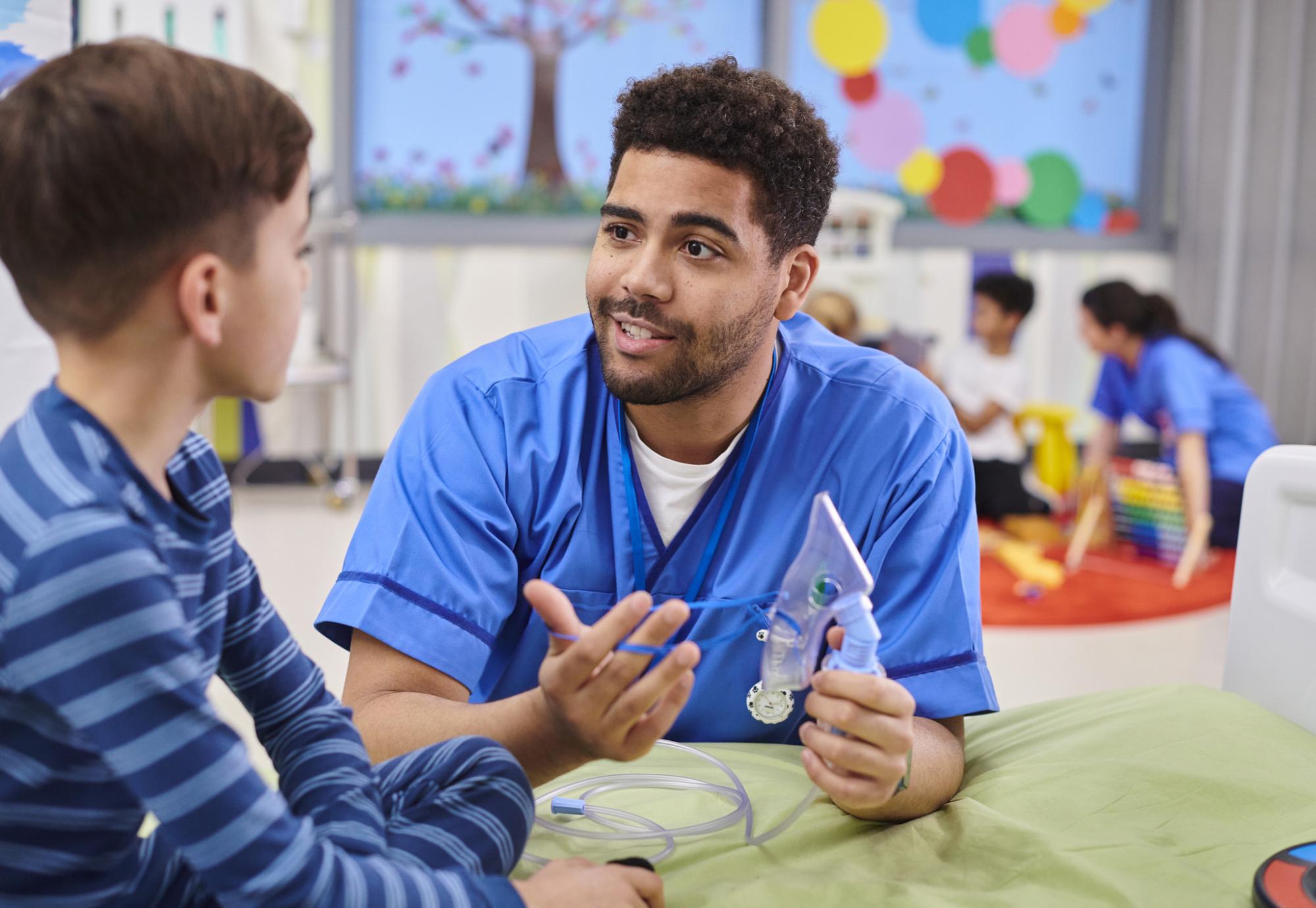 paediatric nurse talking to patient