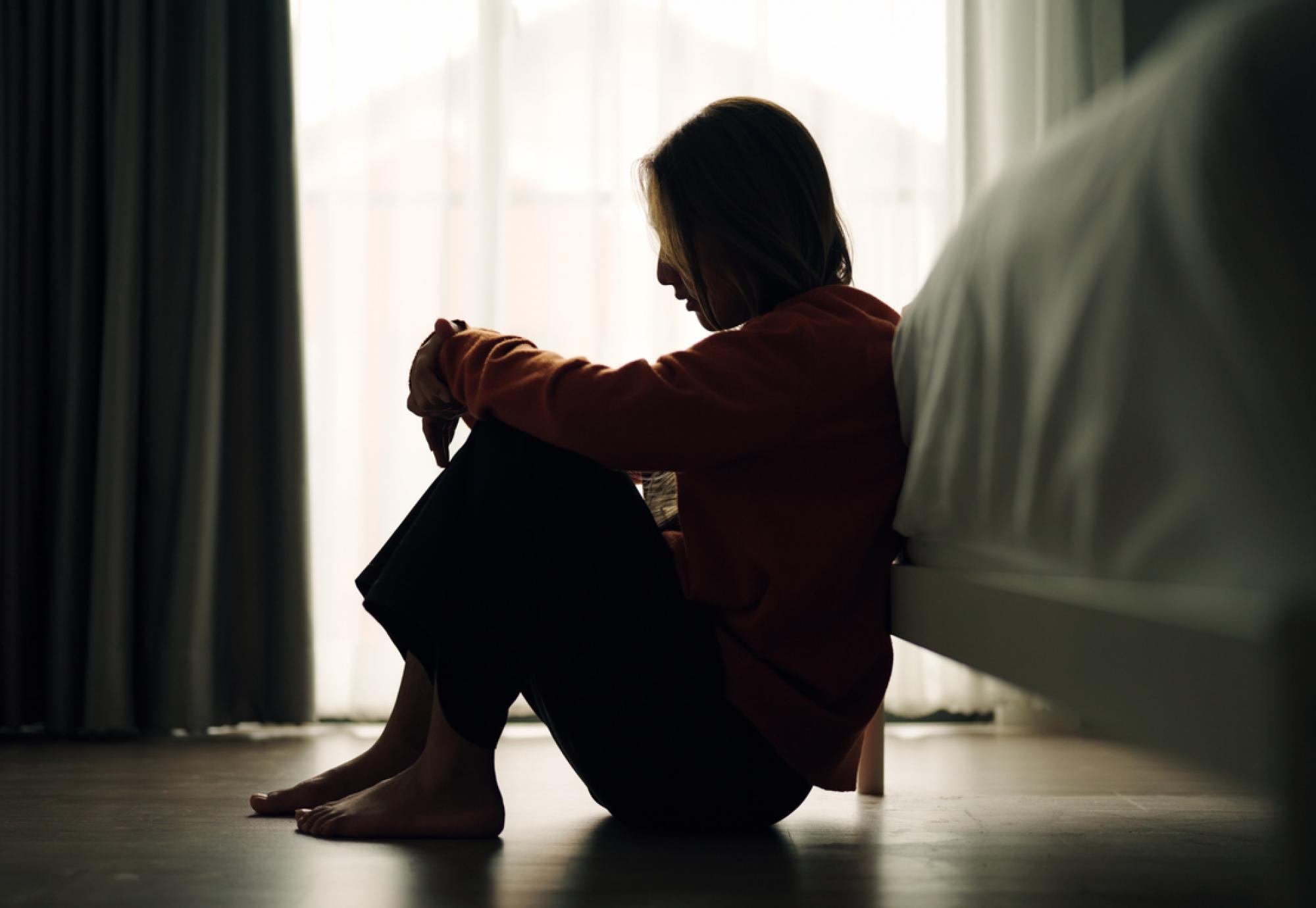 A woman struggling with her mental health