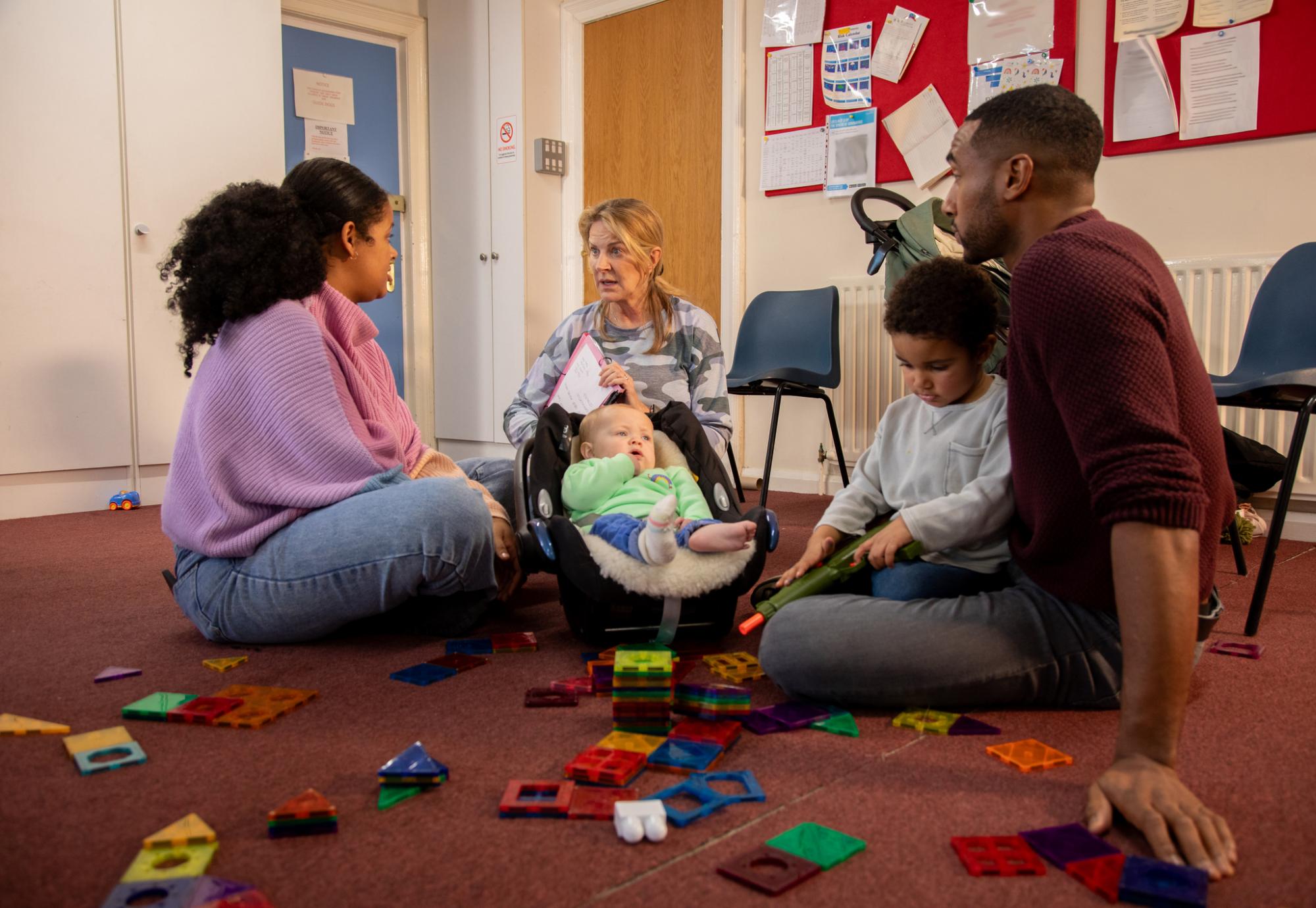 Family in a session with a childcare worker