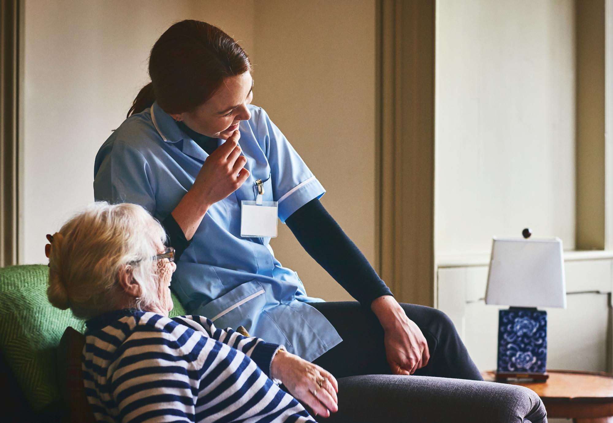 Social care worker with patient