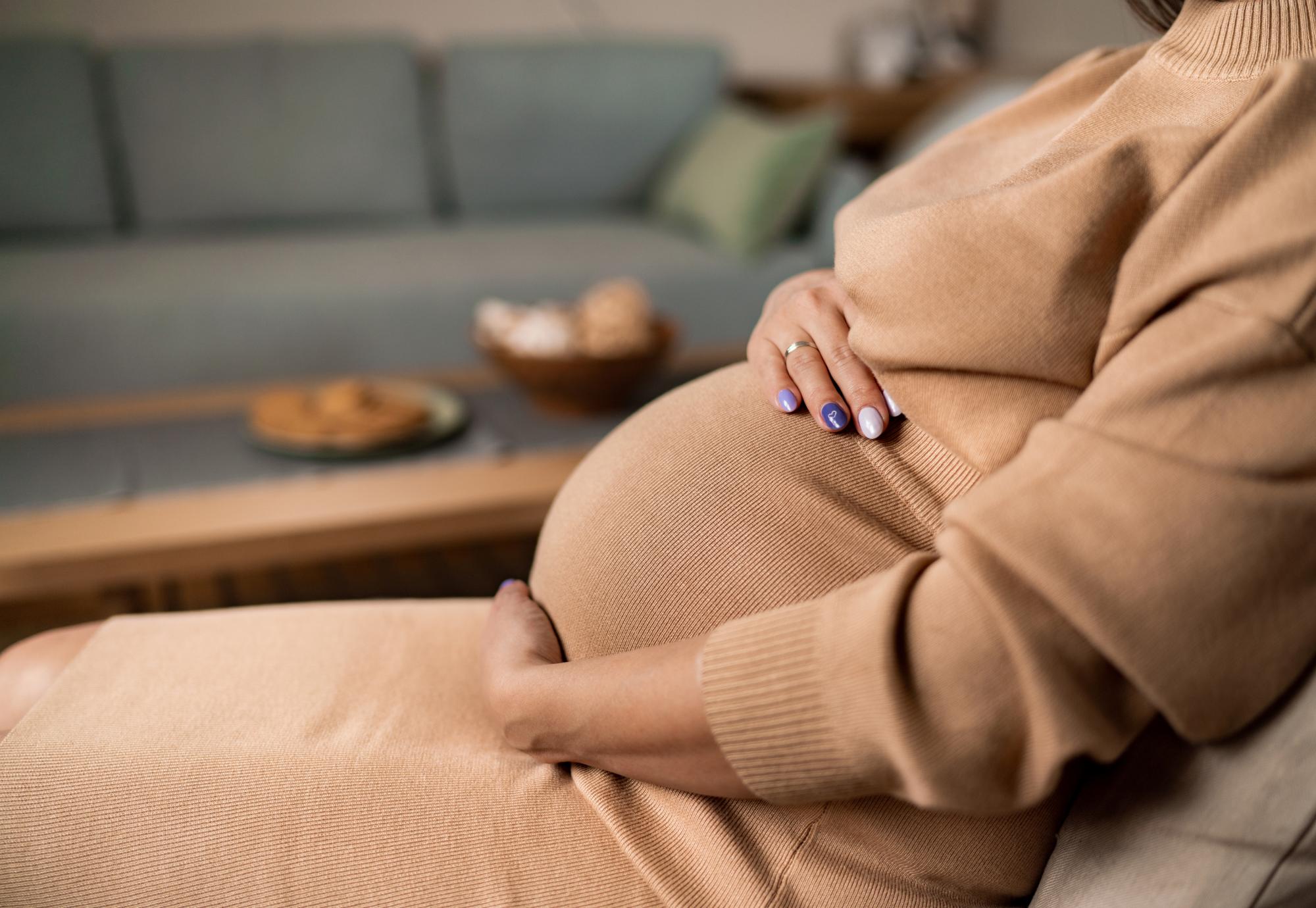Pregnant woman sat down