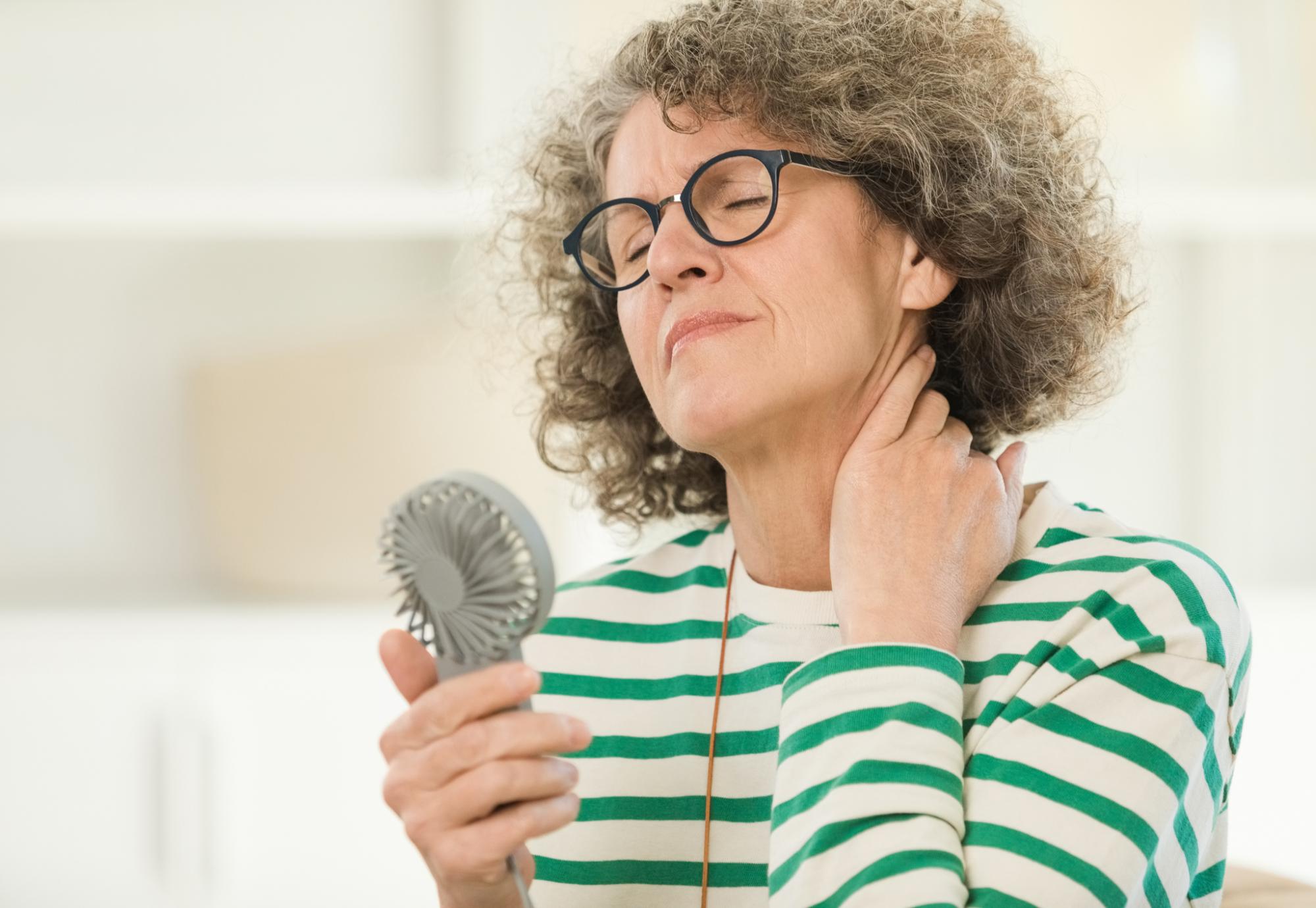 Menopausal woman having a hot flush