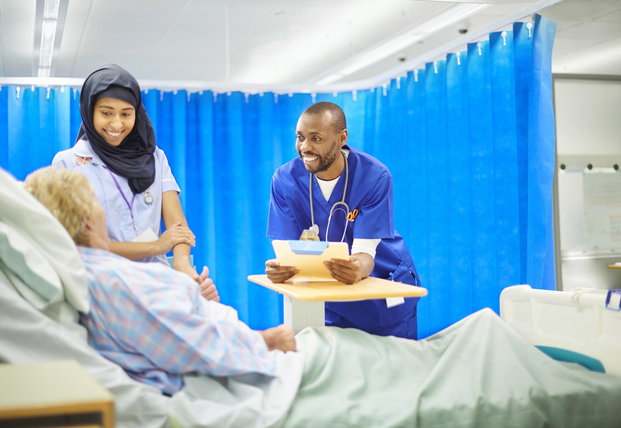Two NHS staff with a patient