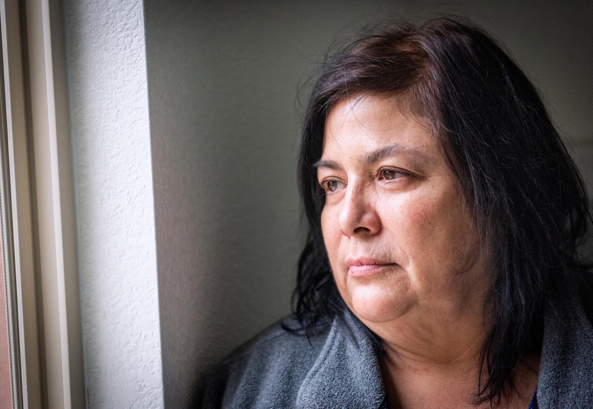 Woman looking out of window