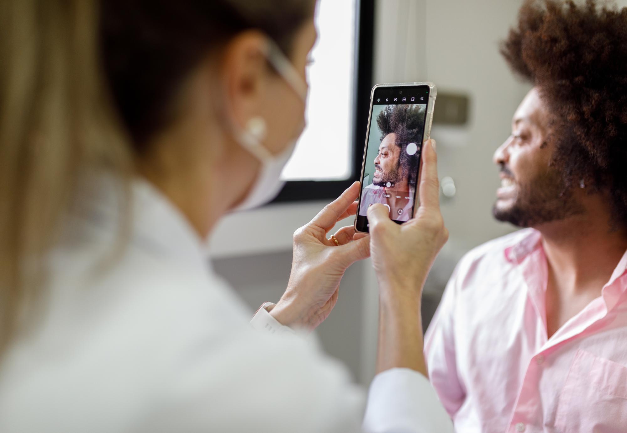 Doctor taking photo of an injury