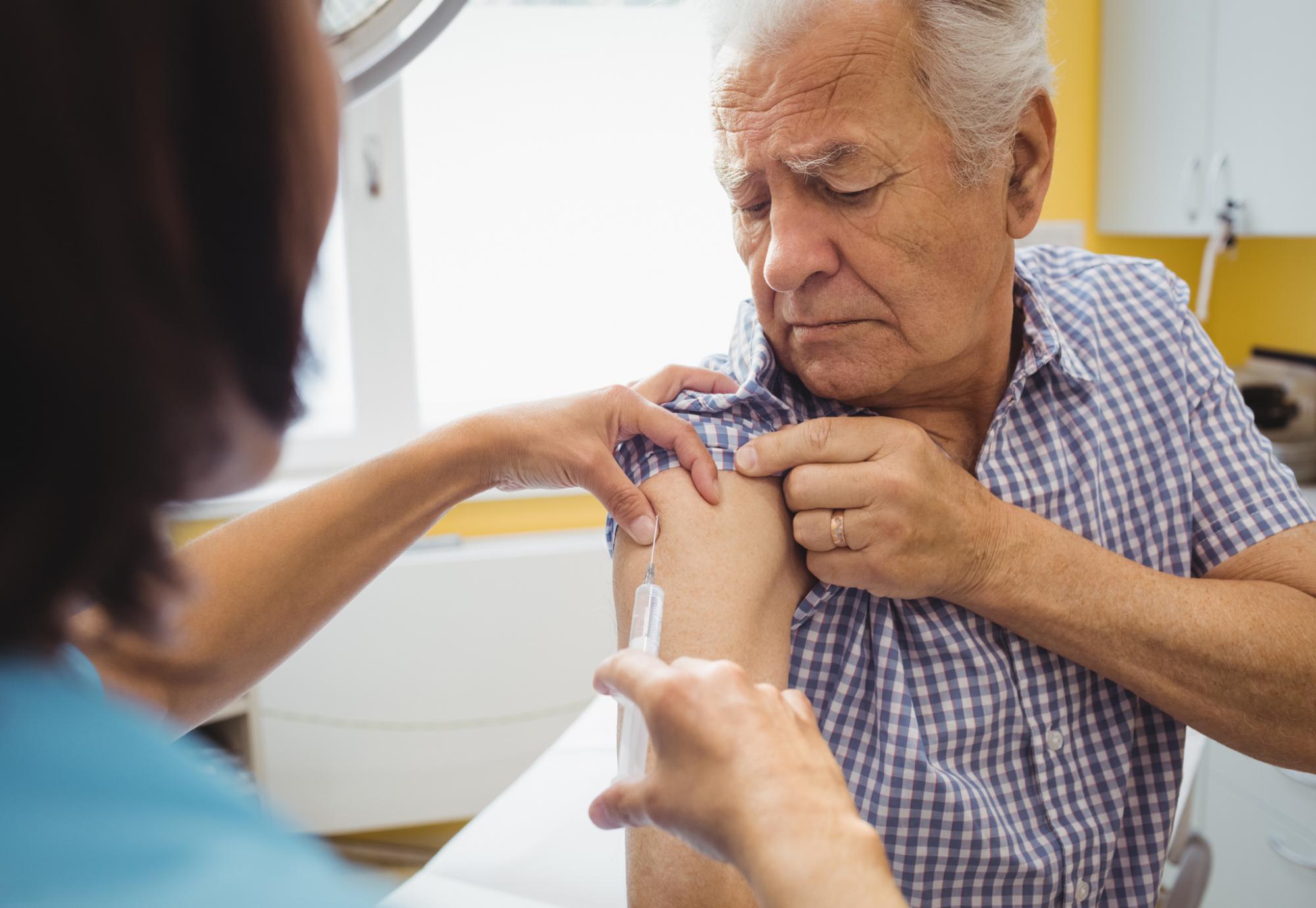 Older person being vaccinated