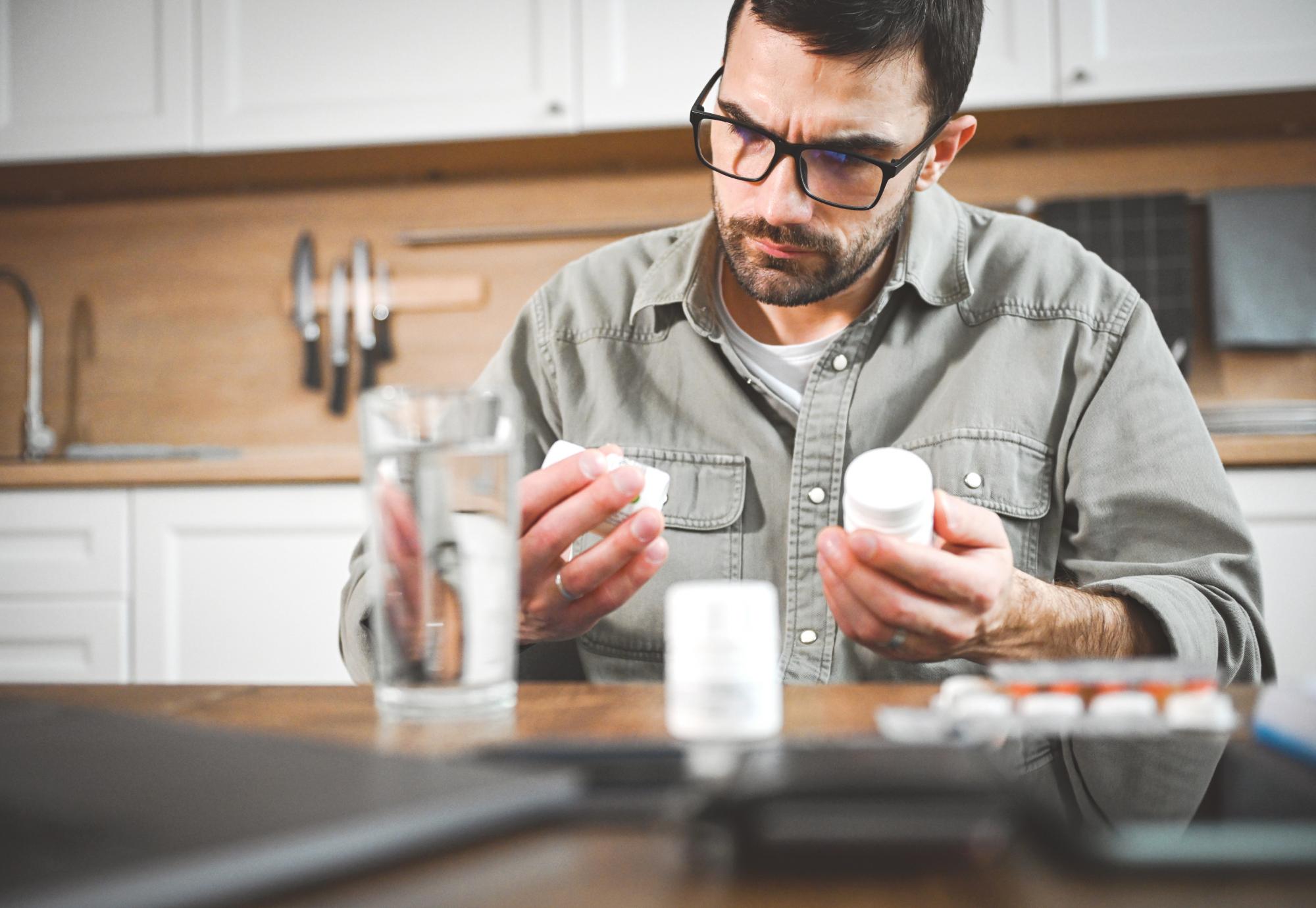 Man taking a pill