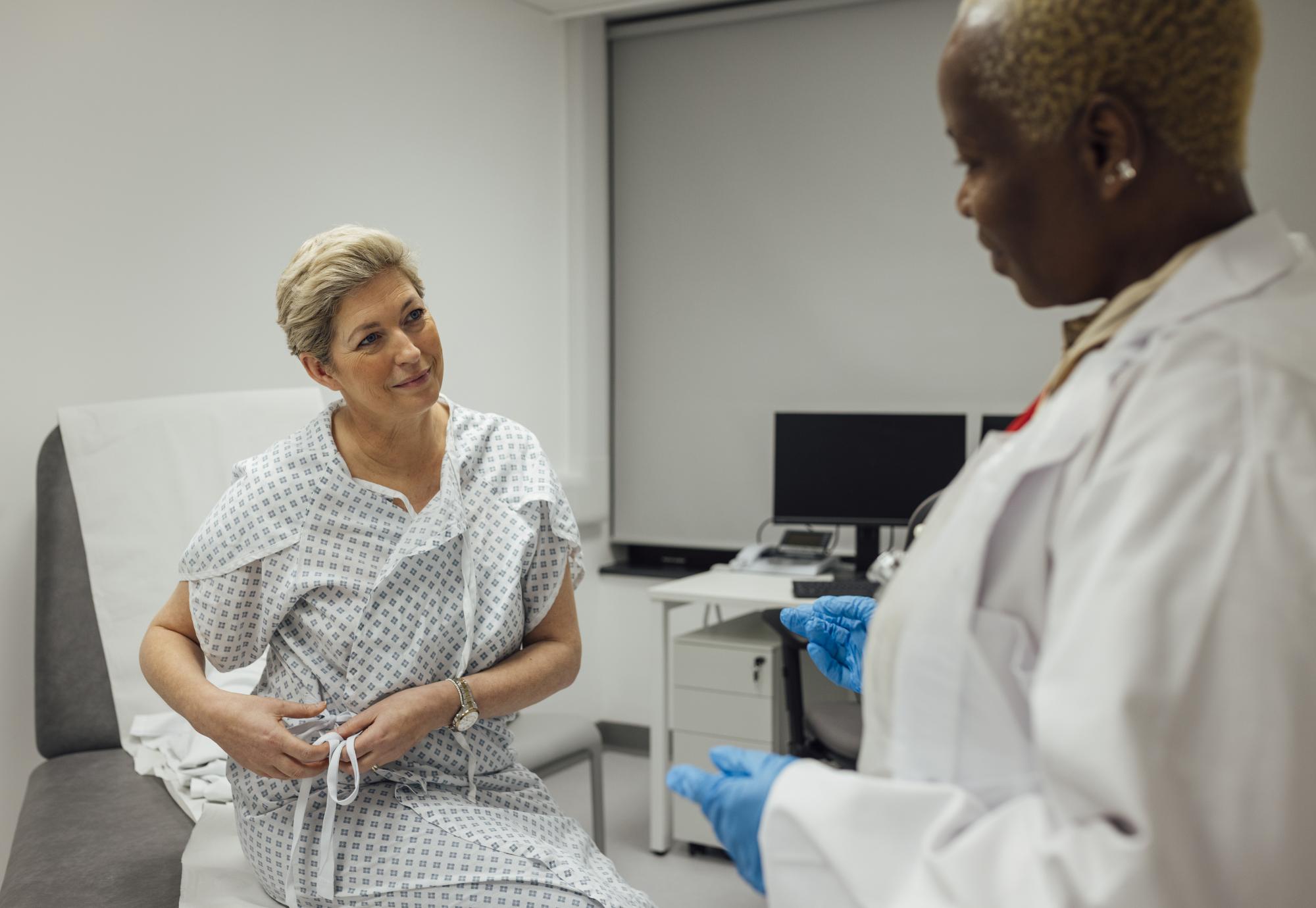 Breast cancer patient with doctor