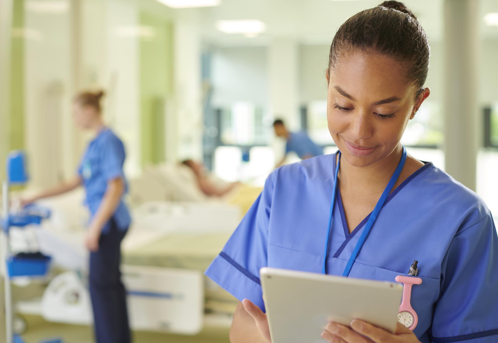 NHS nurse using iPad