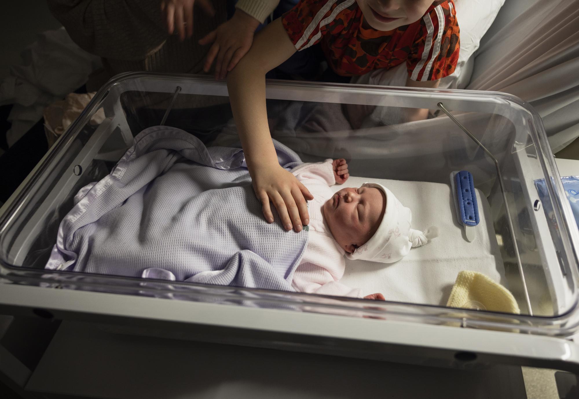 Newborn baby with family