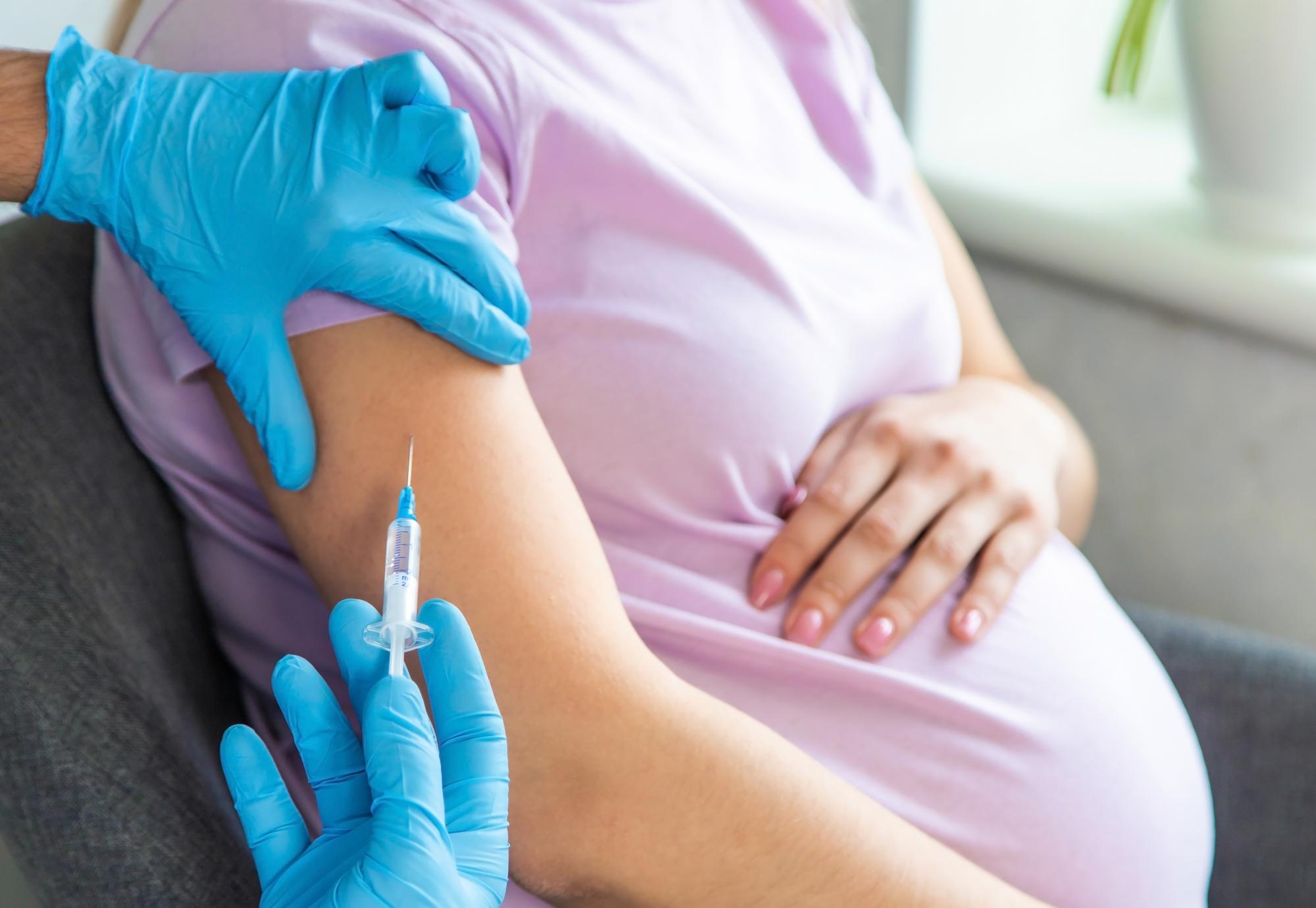 Pregnant woman being vaccinated