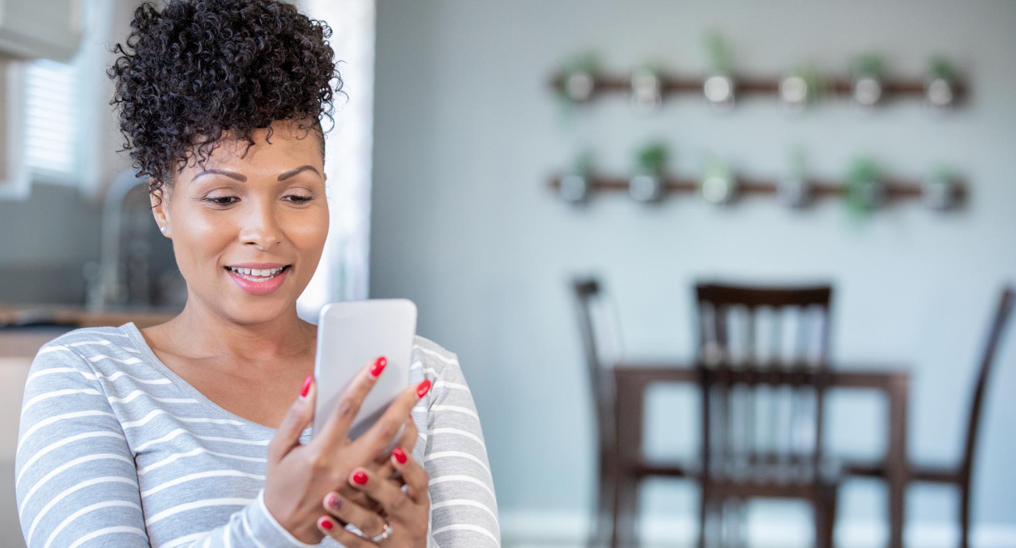 Young woman using her mobile phone