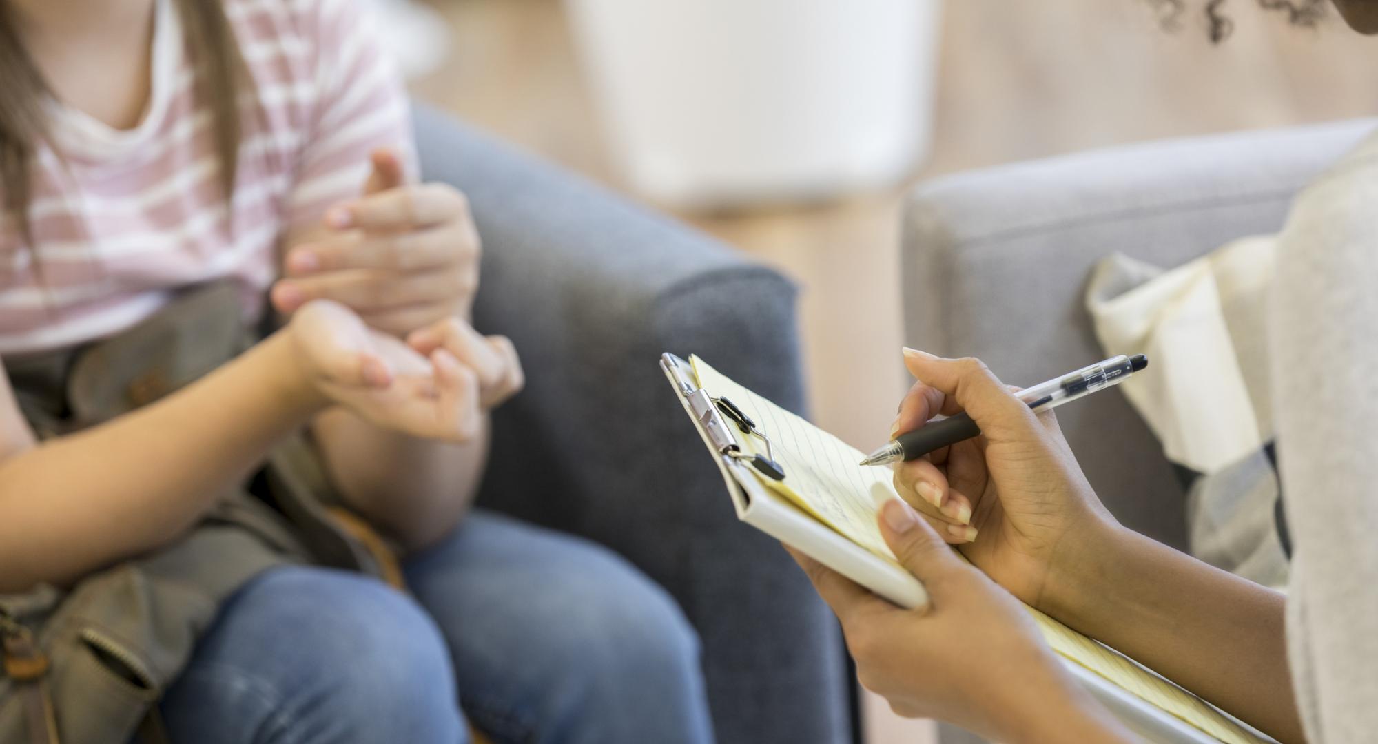 Young person talking to a health professional 