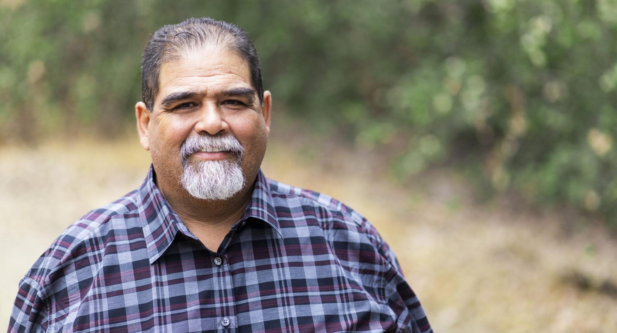 Overweight man smiling at the camera