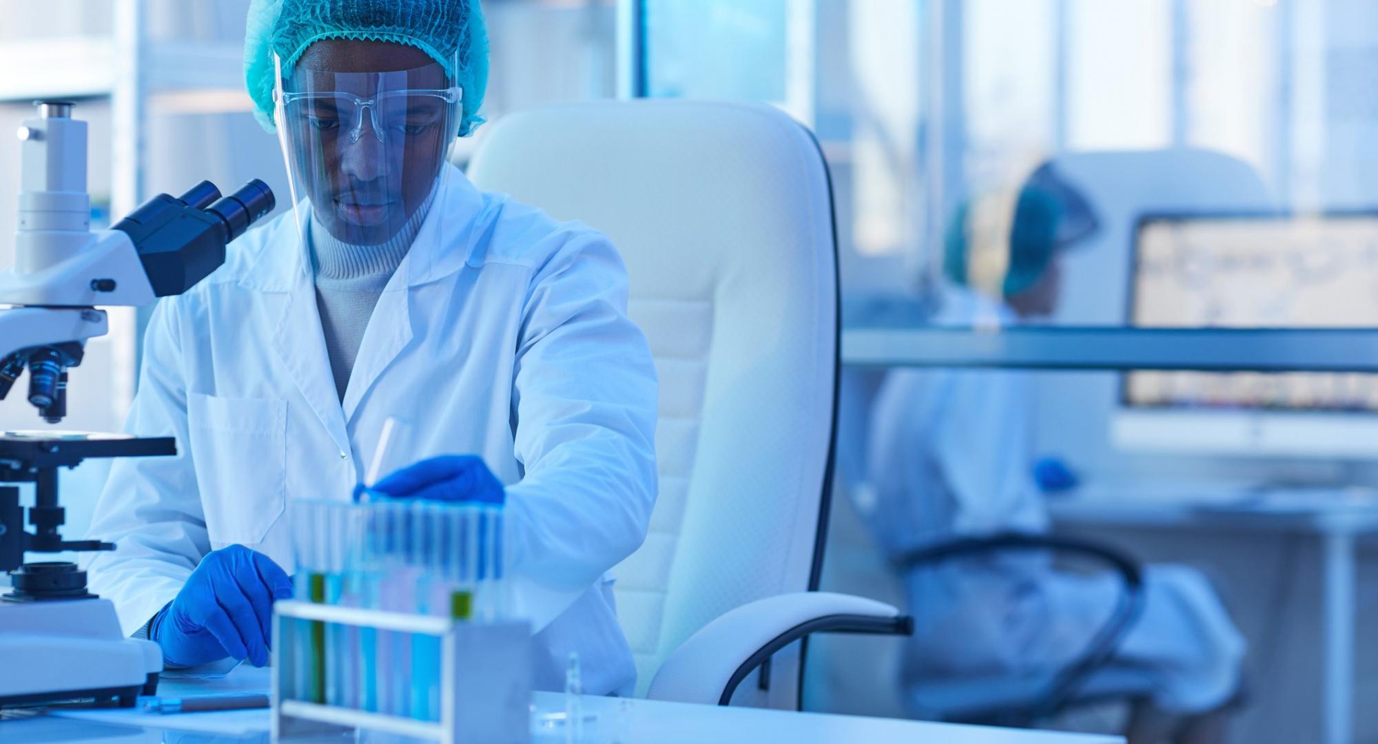 Male lab technician carrying out tests with lab equipment