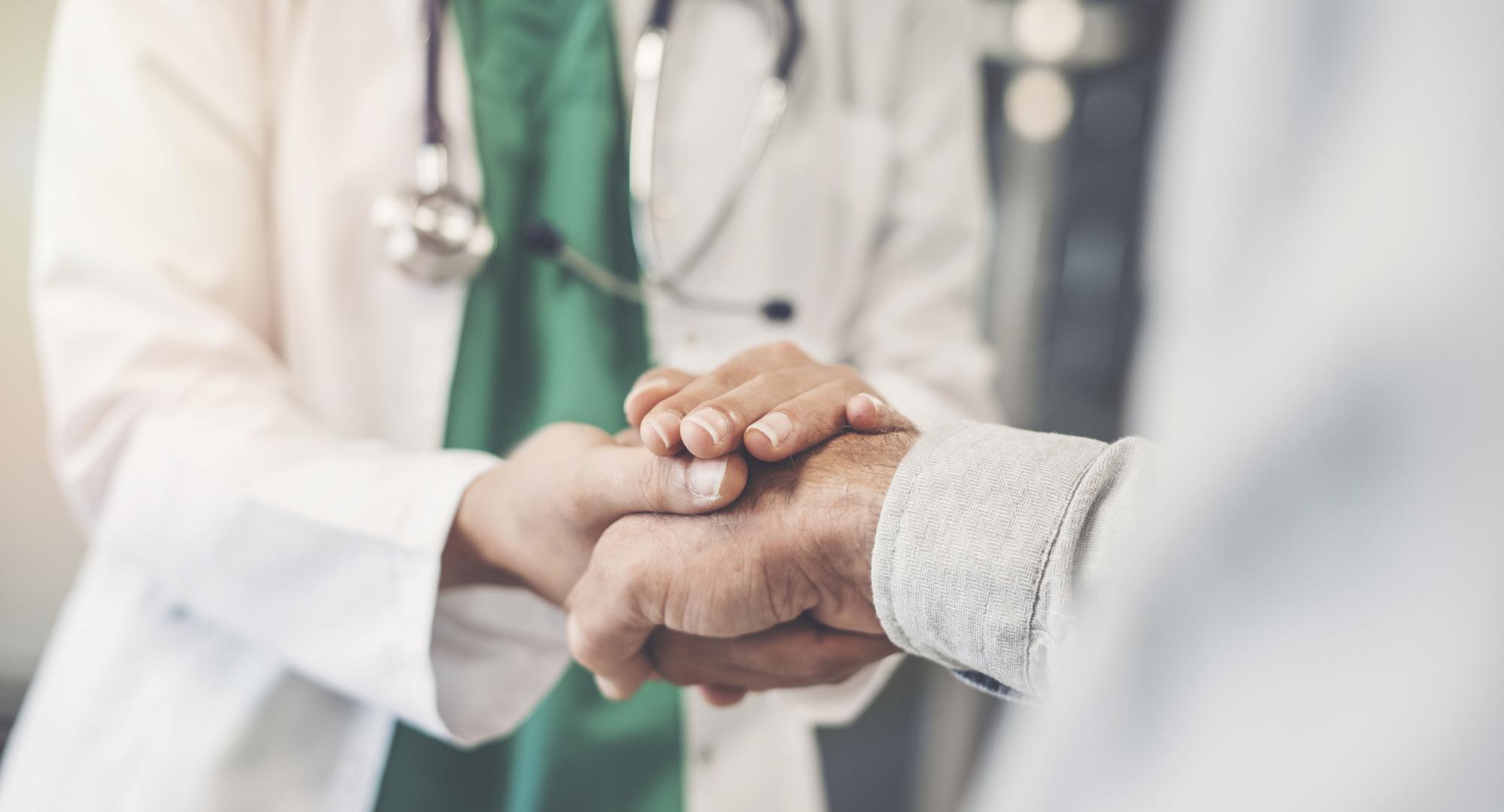 Health professional shaking hands with a patient