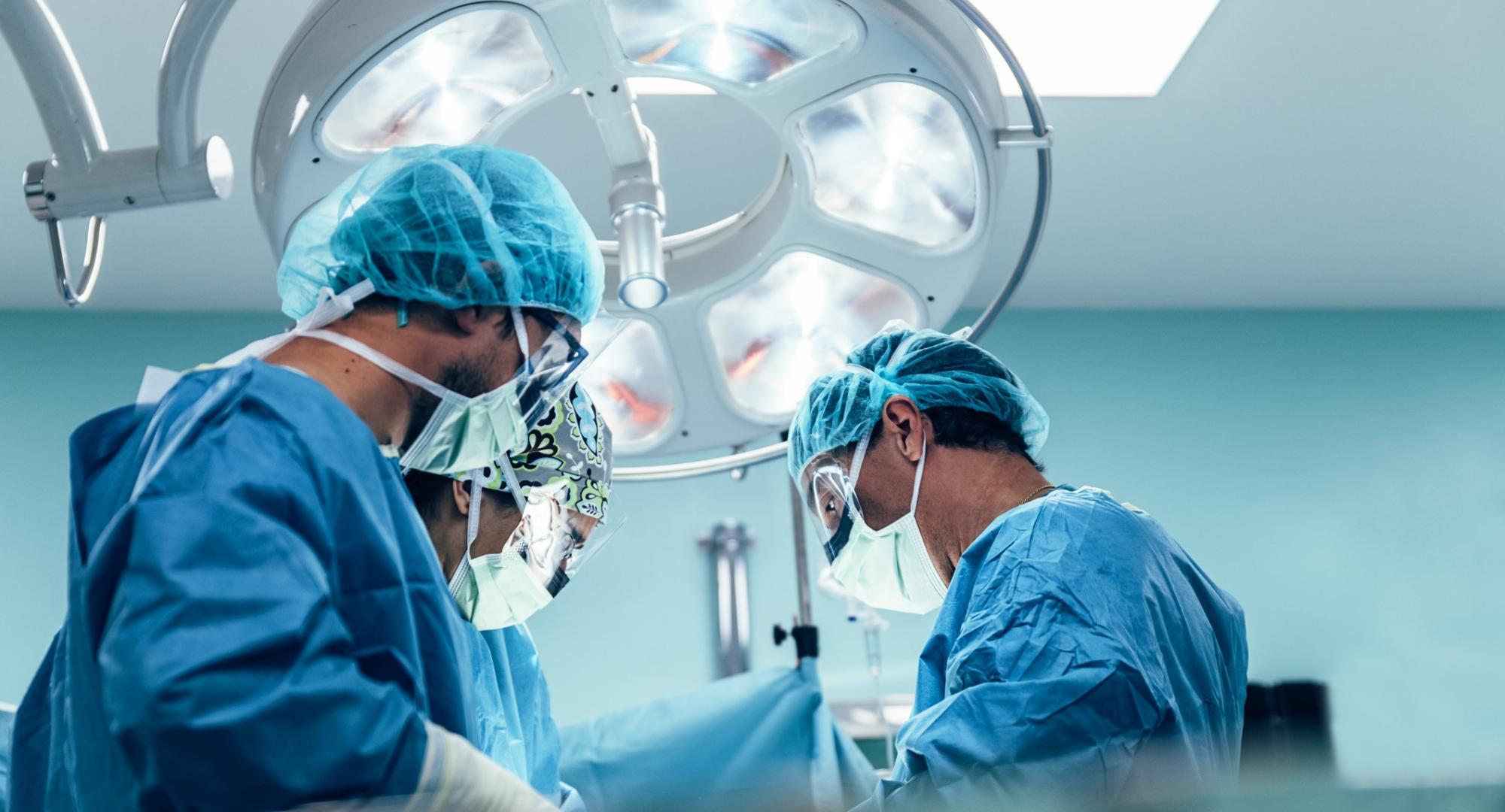 Surgeons operating on a patient