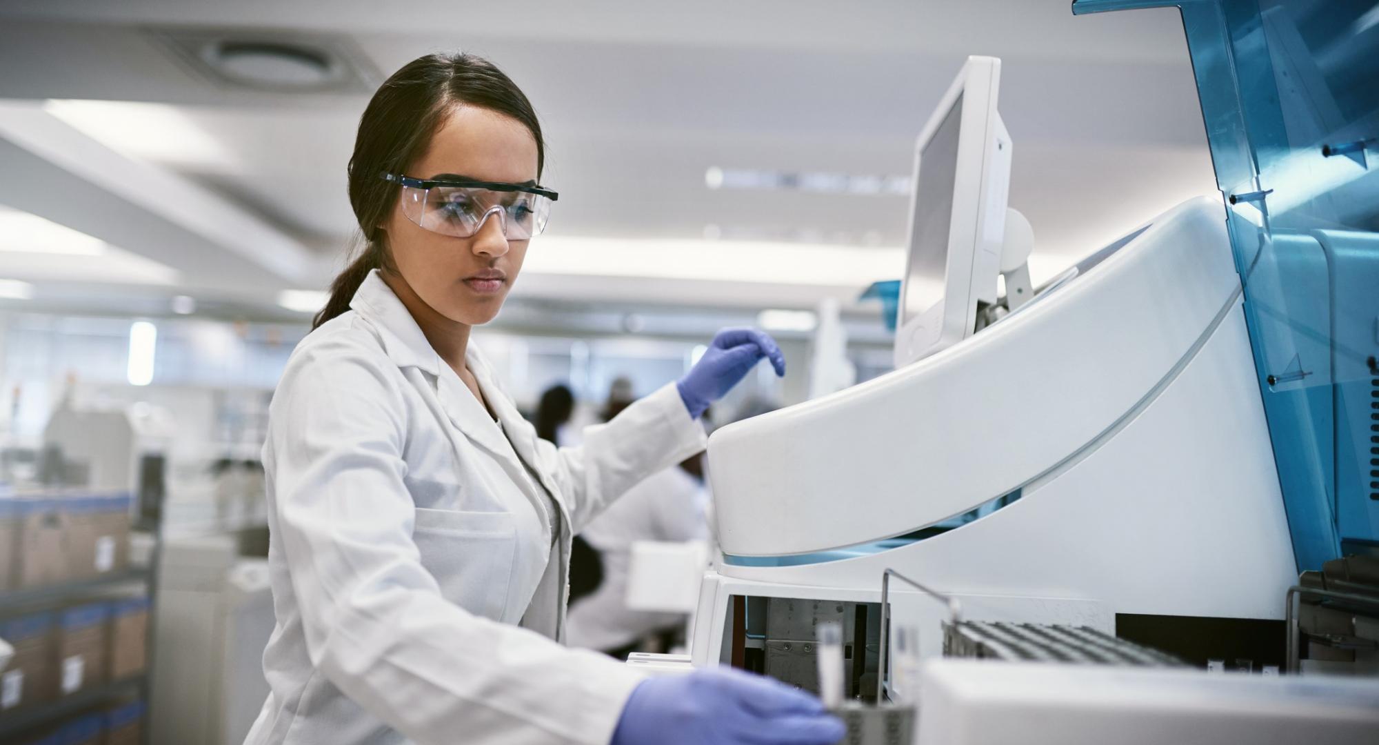 Female medical professional using diagnostic equipment