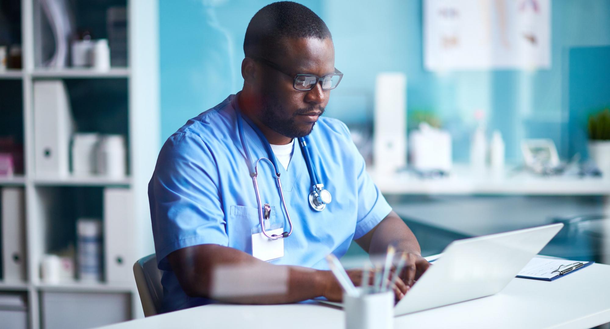 Nurse using a laptop to talk with patients