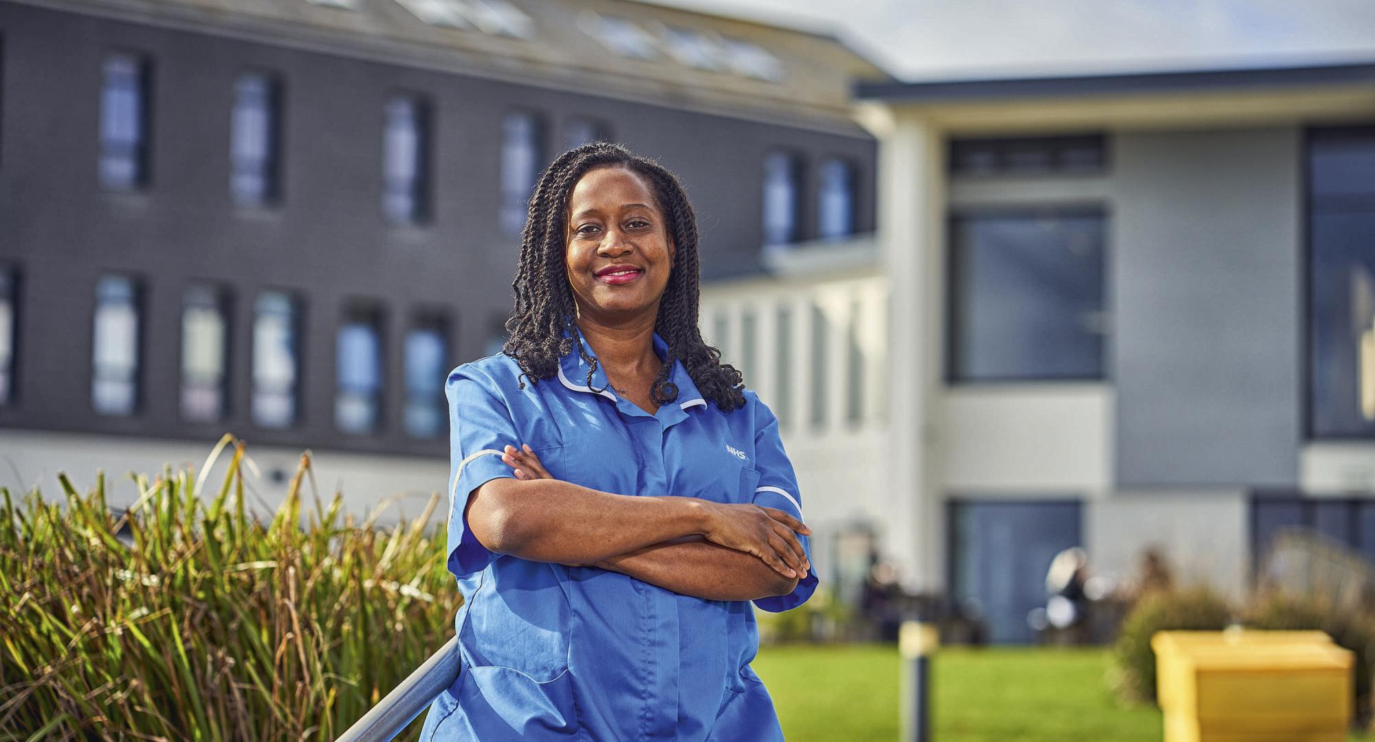 Nurse standing outside of a hospital