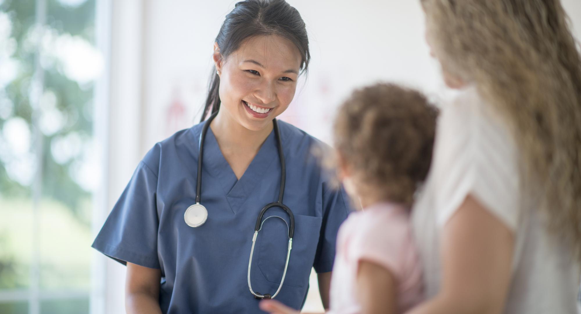 Female nurse with a young child