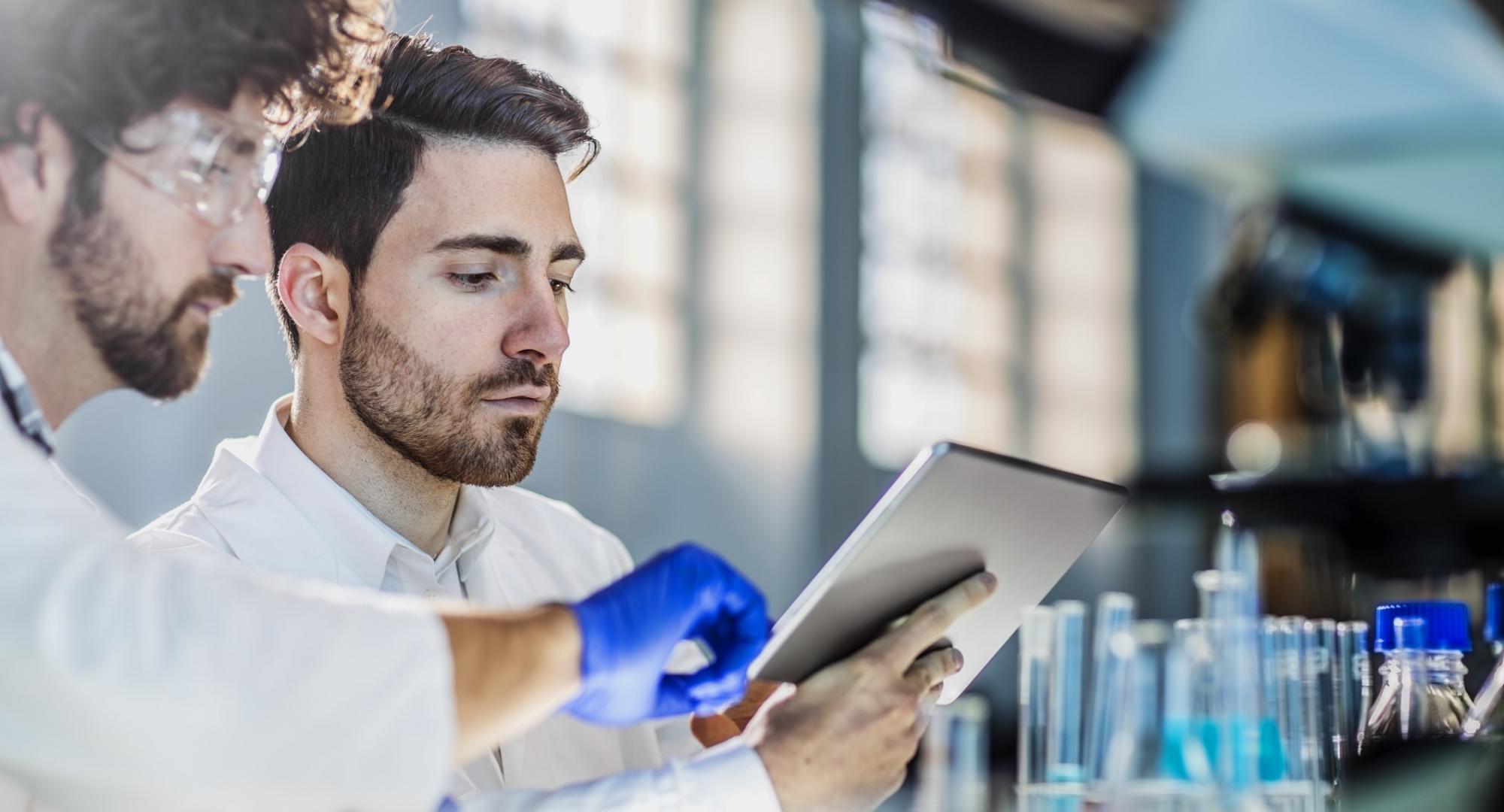 Lab workers looking at some data