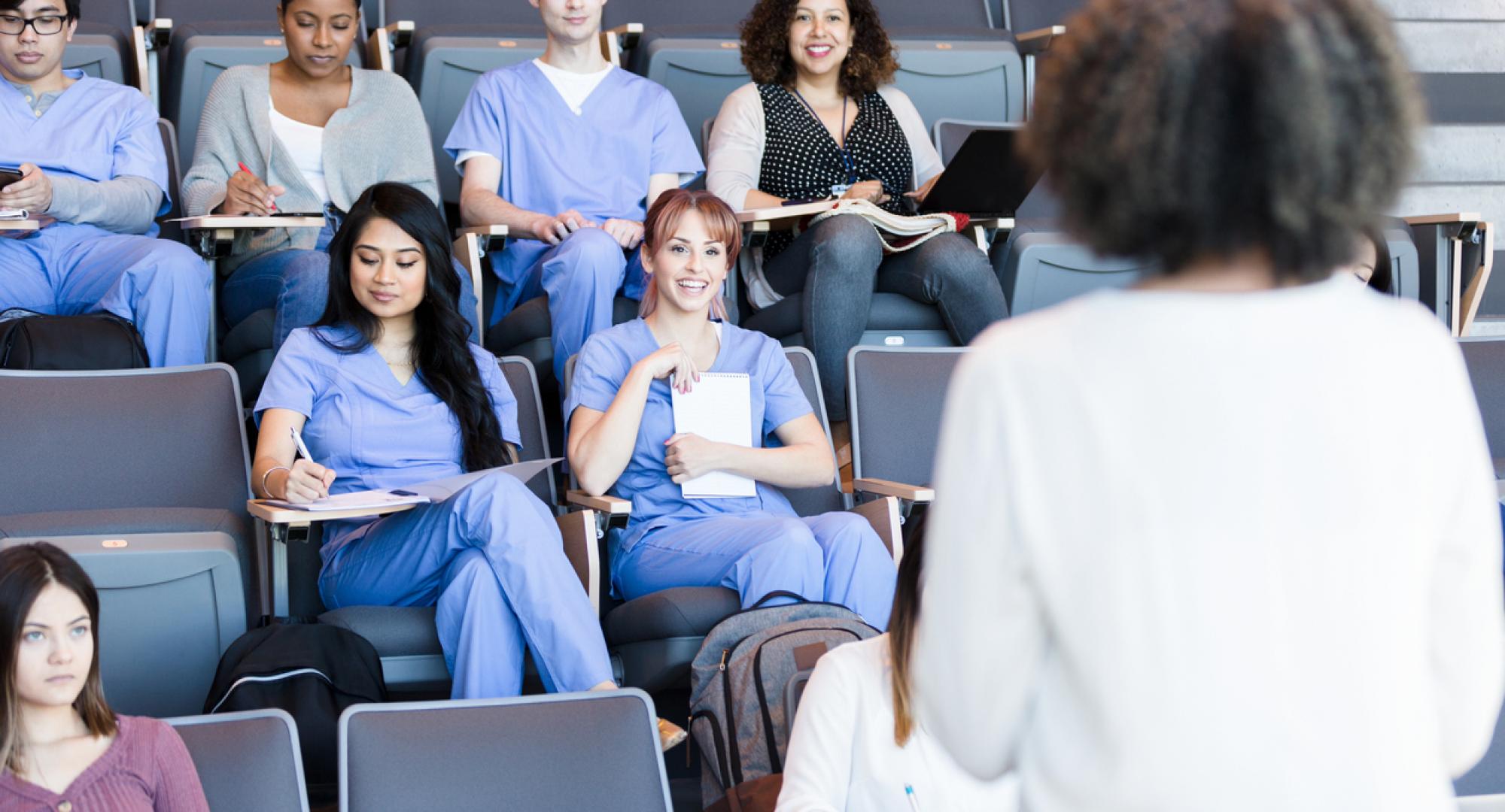 Healthcare educator teaches class of medical students
