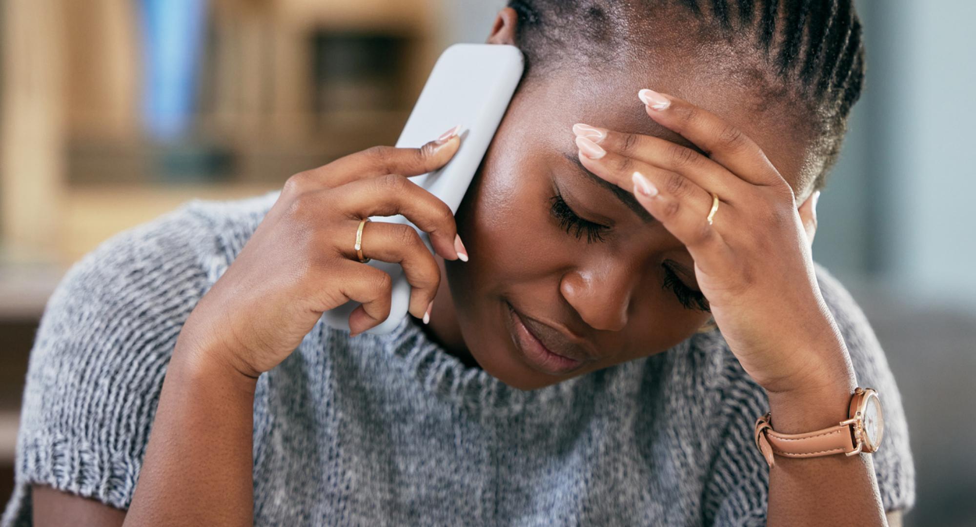 Woman struggling with mental health on phone call