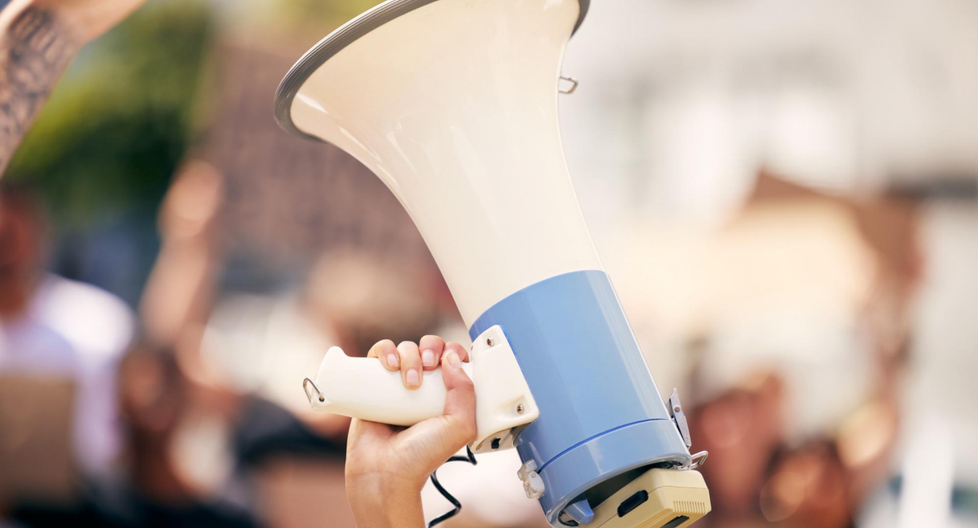 Protester holding a megaphone during a rally
