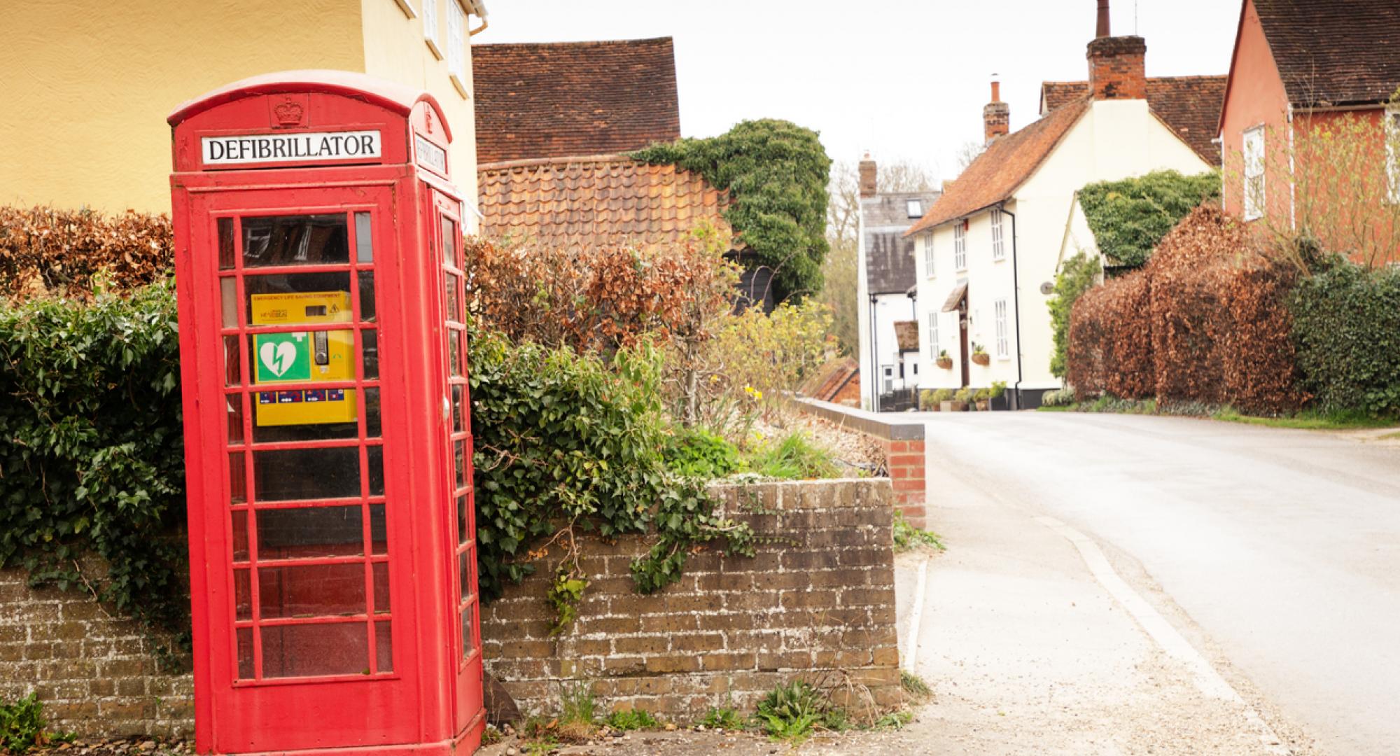 Defibrillator being used in an old phone box