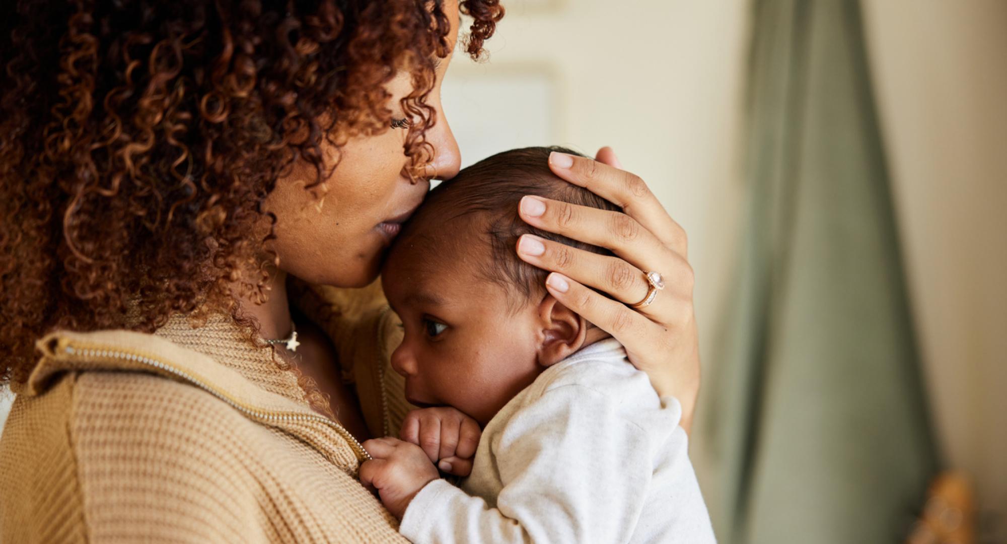 Mother holding her baby