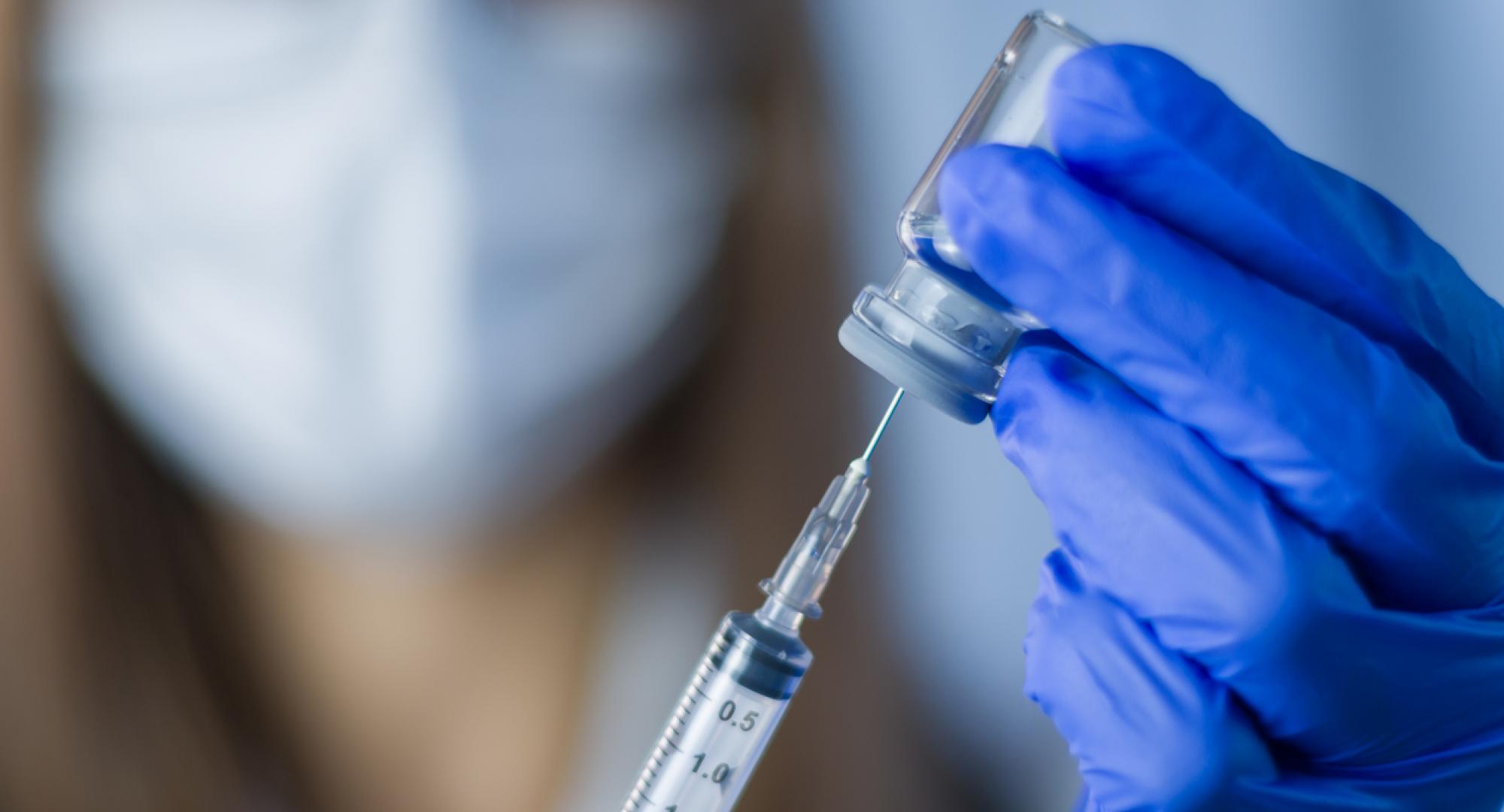 Researcher holding a vaccine