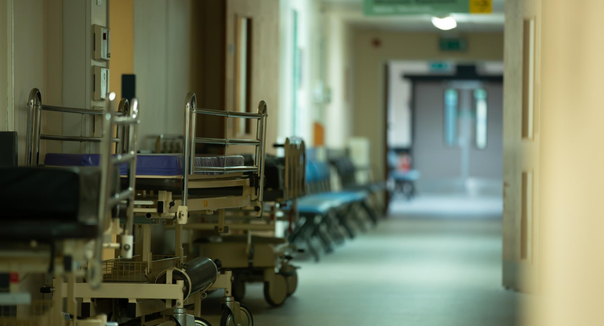 along an empty hallway of a hospital