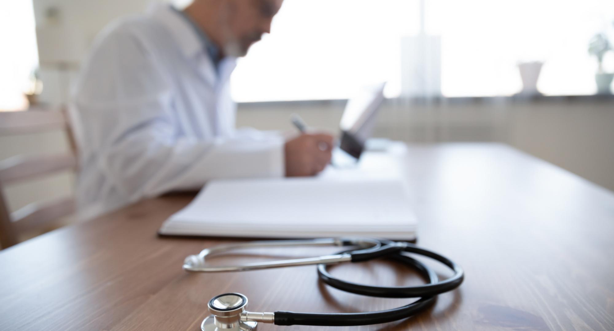 Side-view of a GP in an office