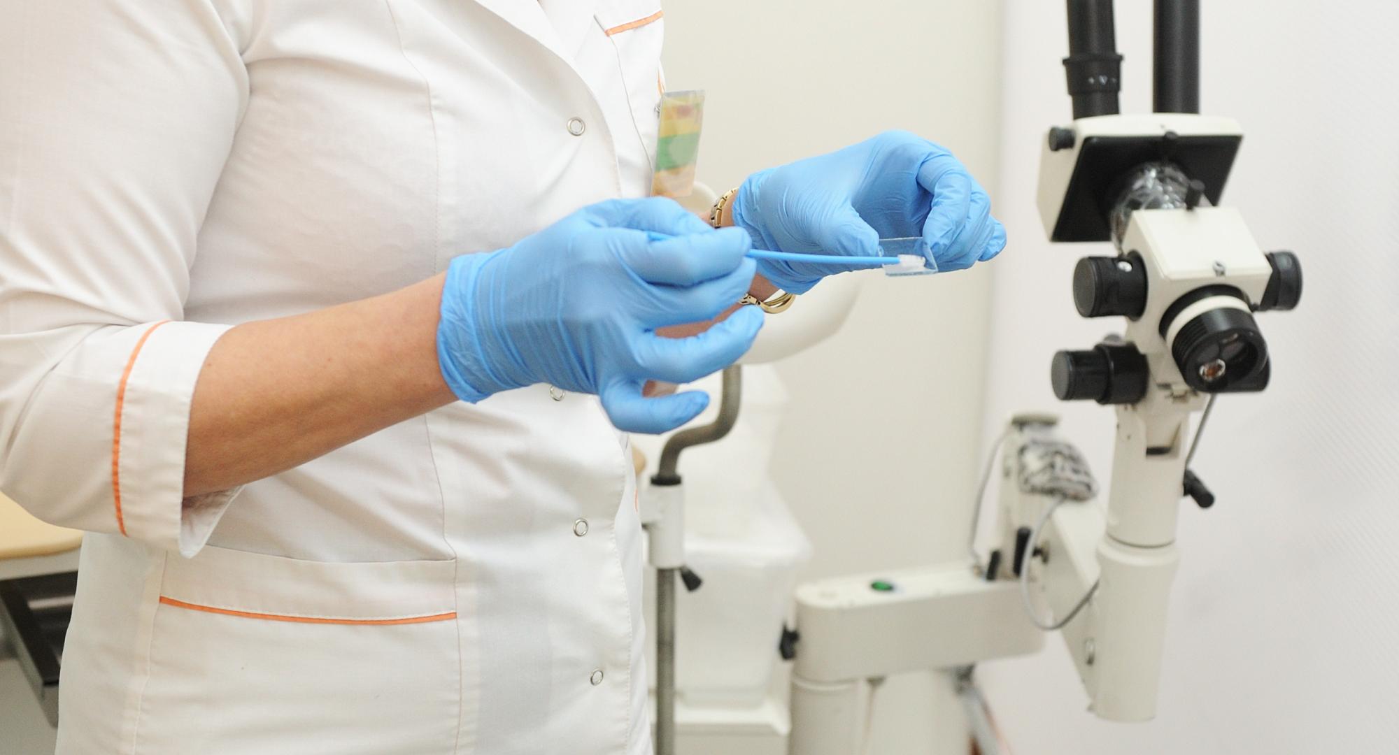 Scientist inspects swab