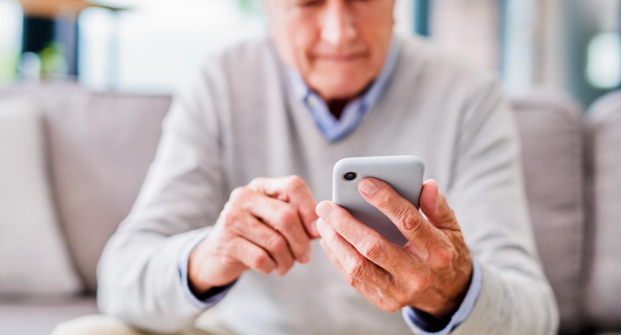 Old man using phone