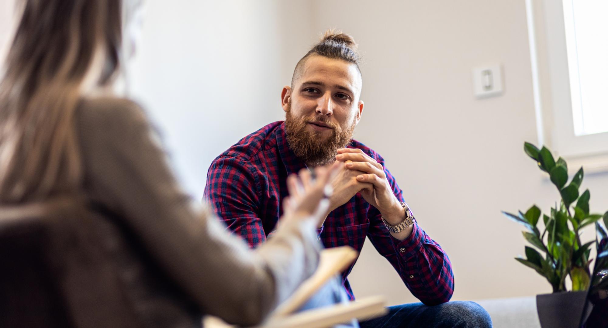 Young man talking to a therapist