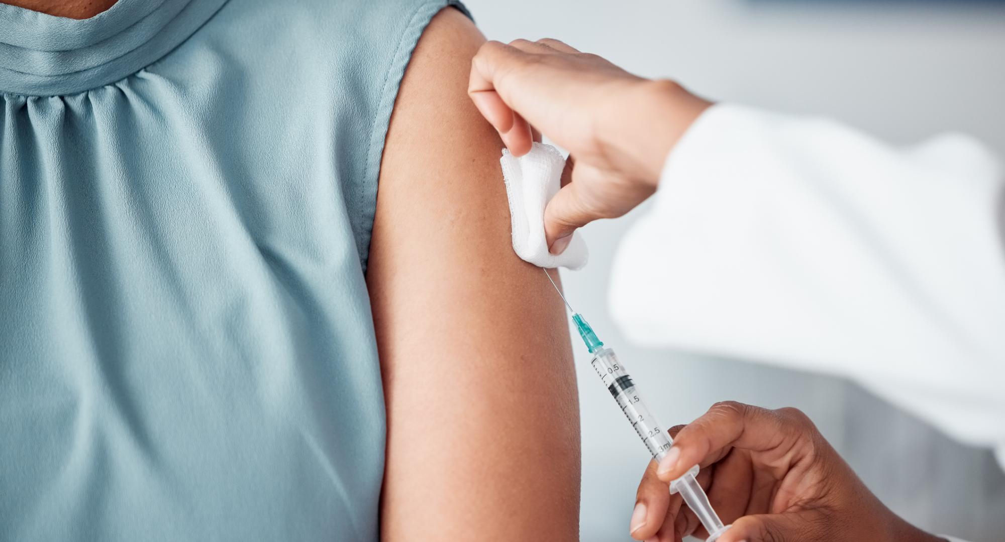 Doctor giving a patient a vaccination