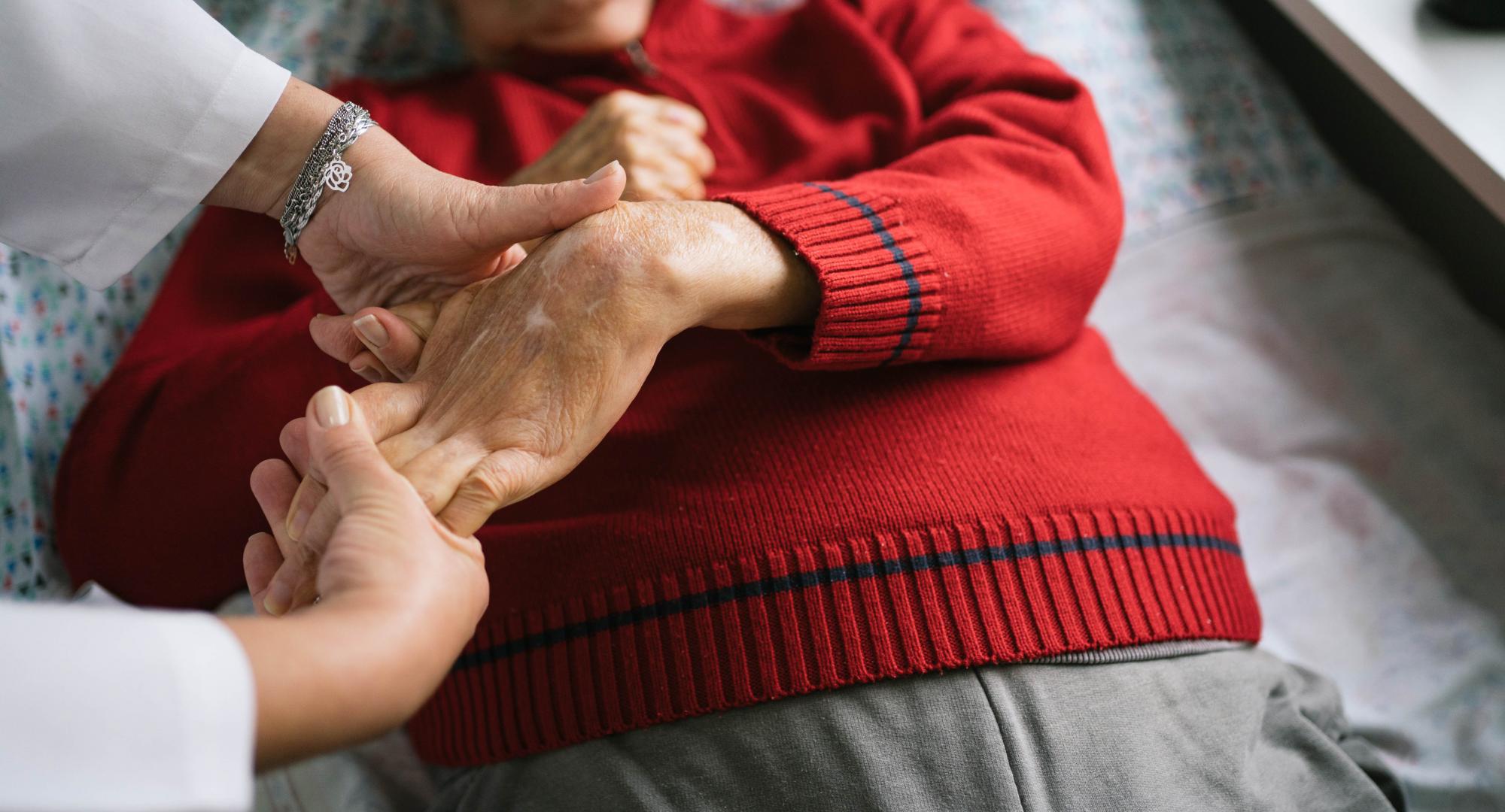Senior man with stroke doing physical therapy