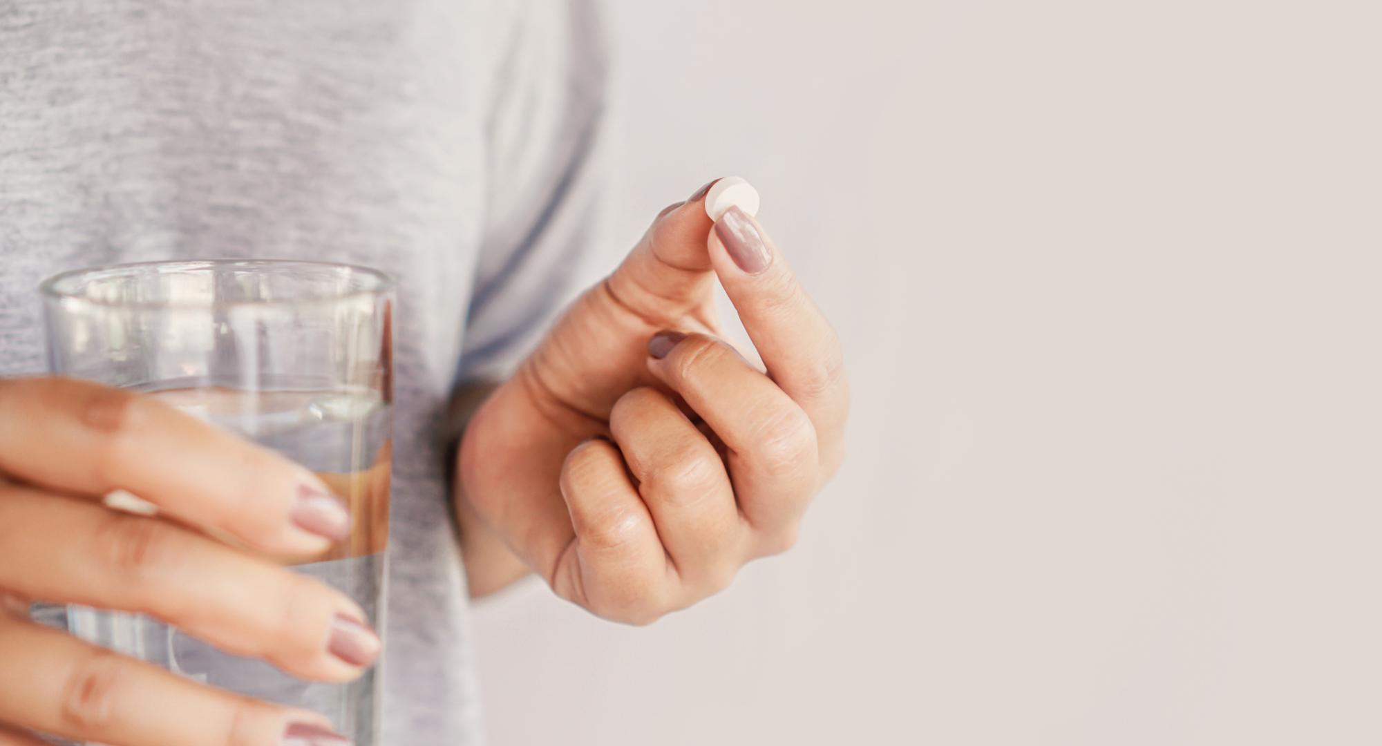Woman taking a pill