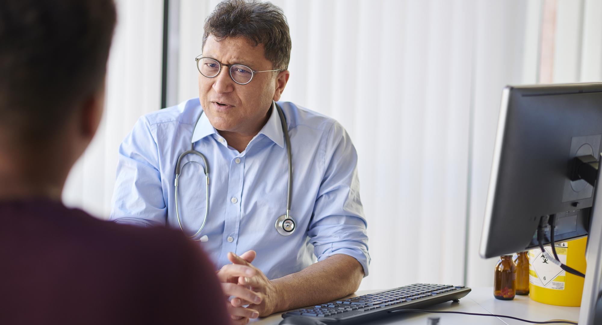 Man speaking to a GP