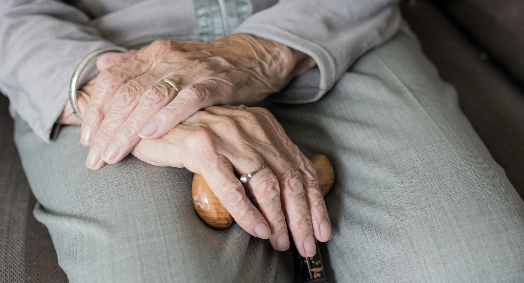 An elderly person's hands