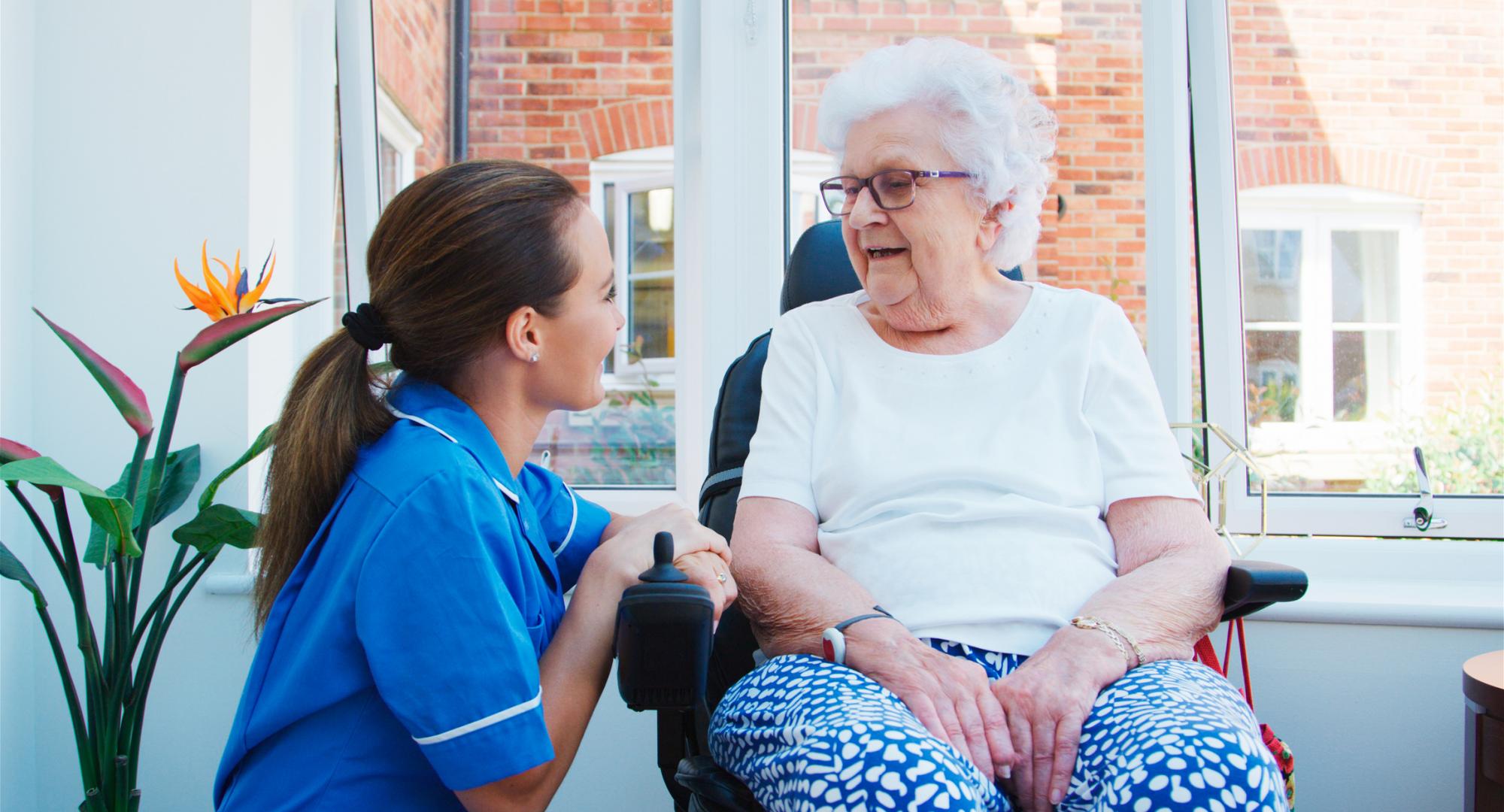 Senior woman talking to a nurse